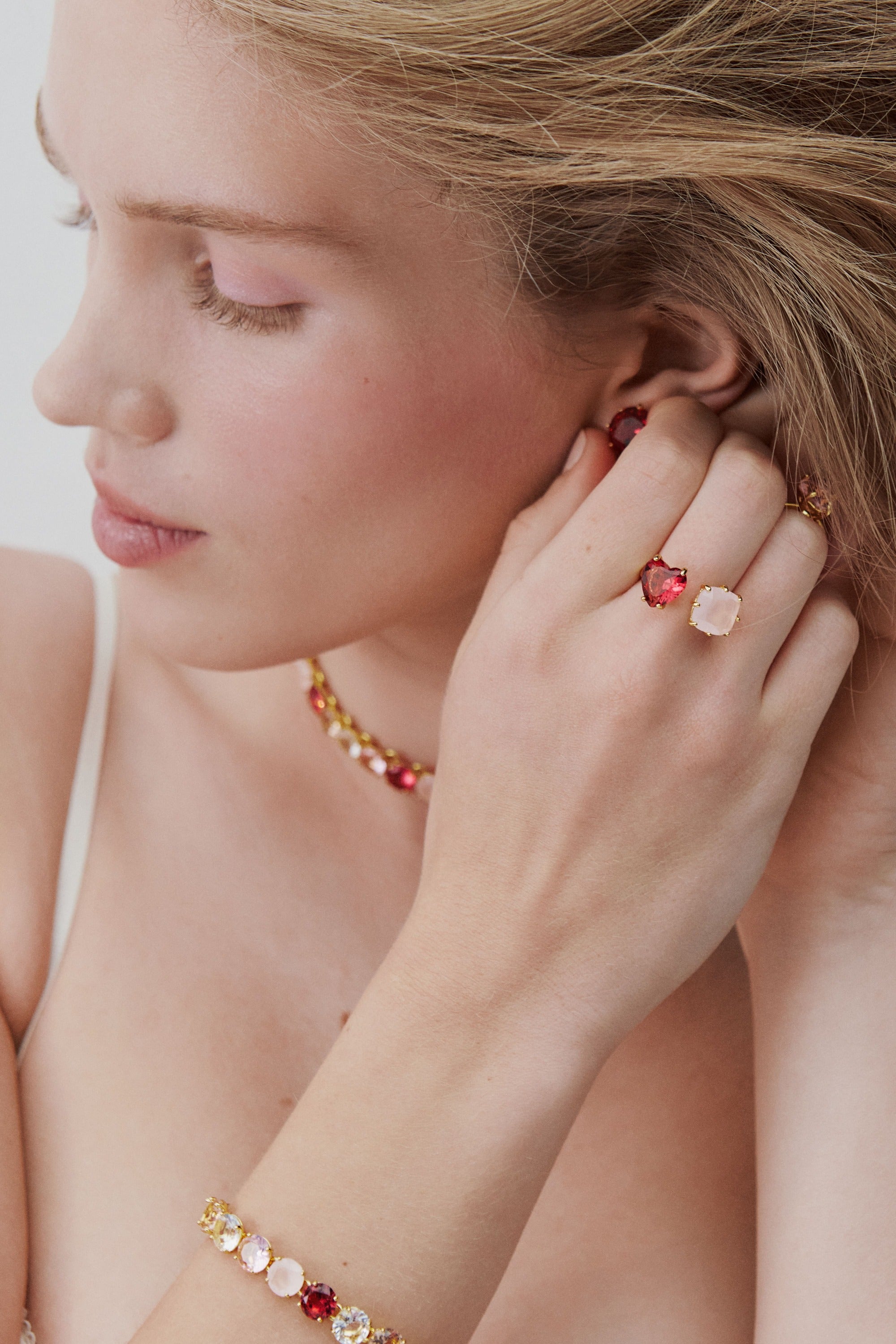 Dark pink and light pink Diamantine you and me ring with heart-shaped and square stones.