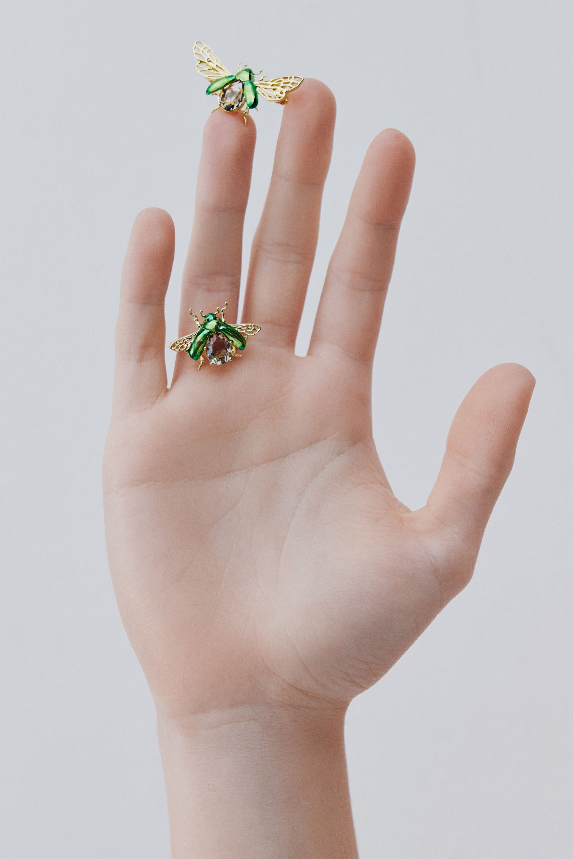 Flying green rose chafer and black faceted stone ring