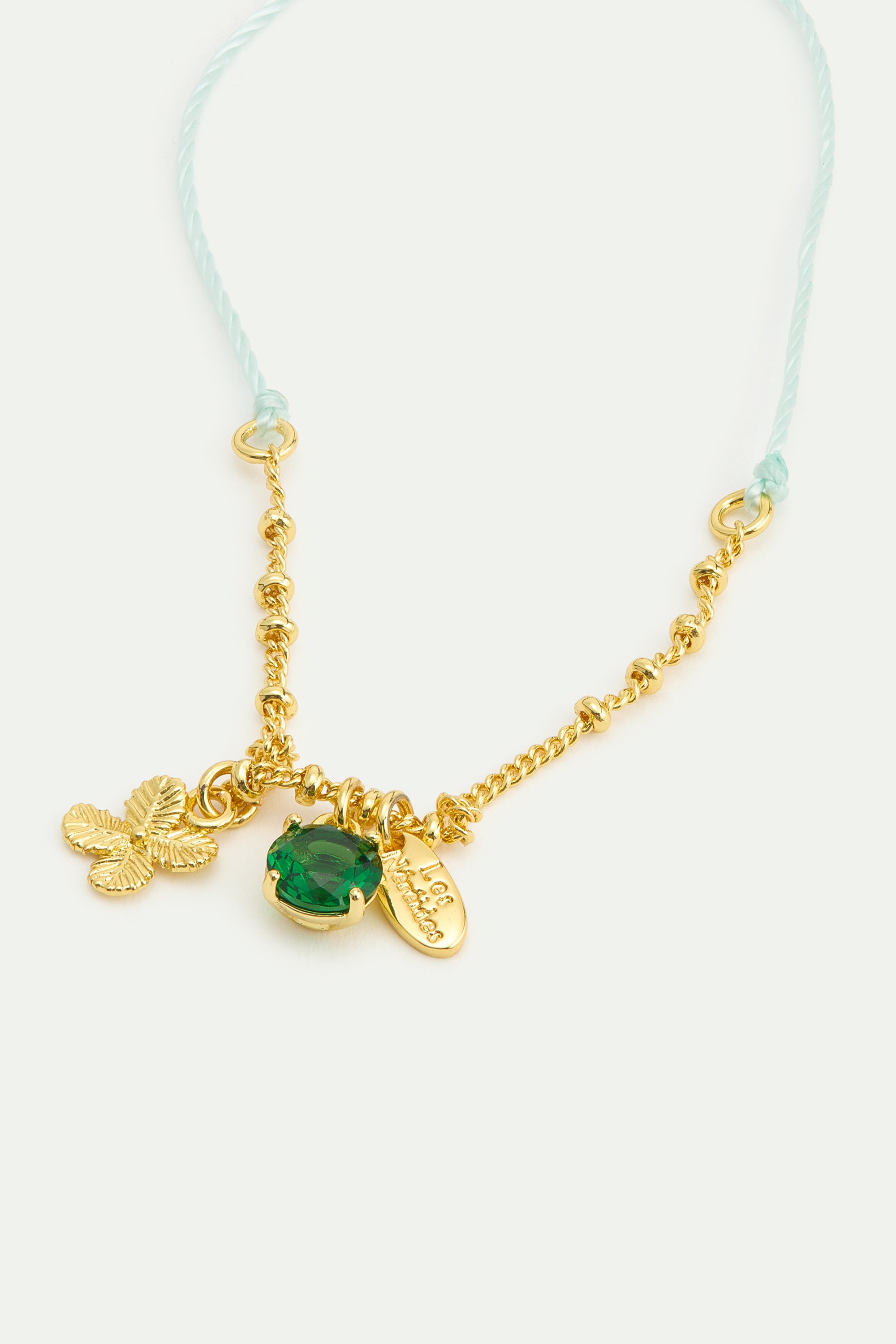 Pulsera fina colgante trébol dorado y cristal facetado verde