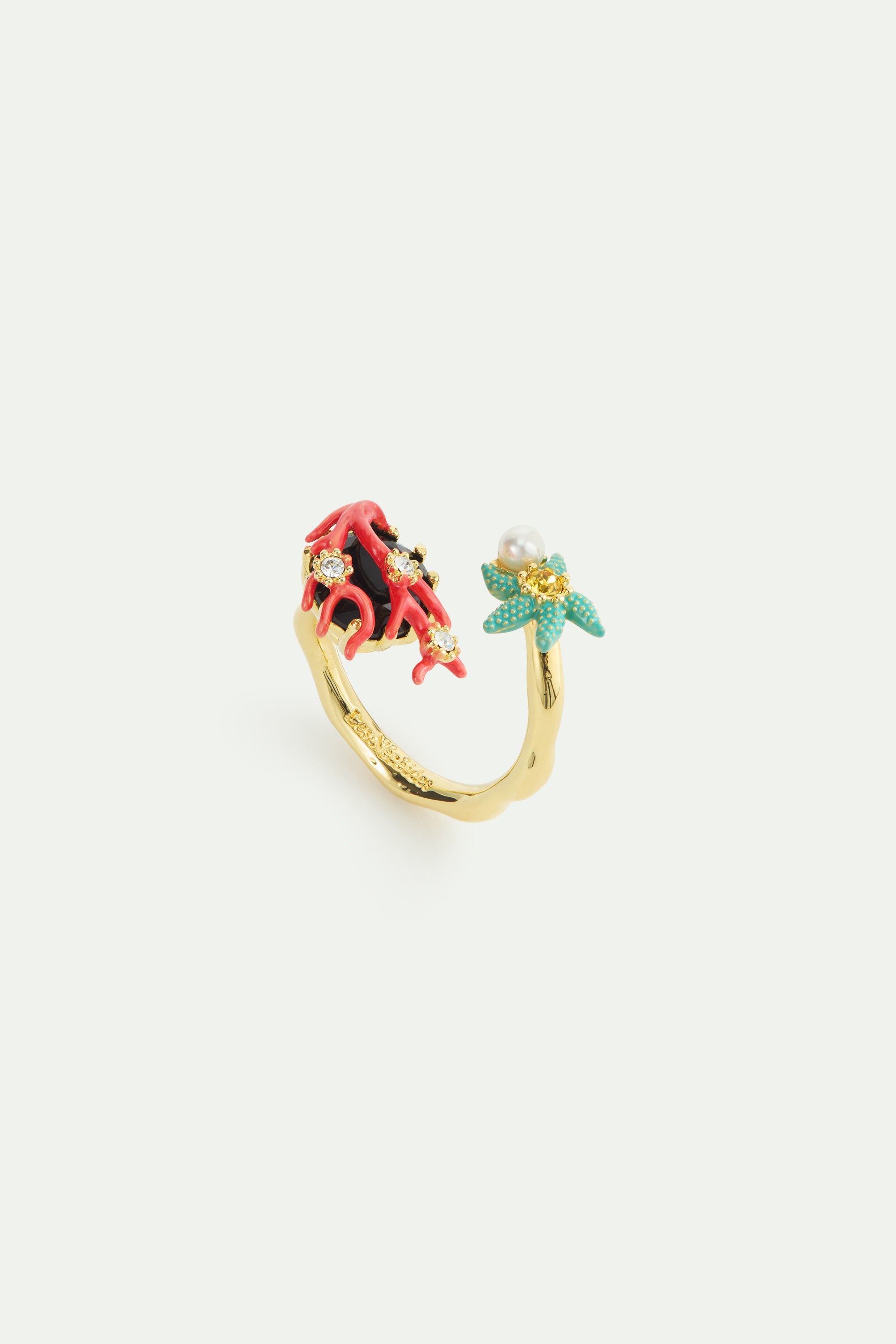 Adjustable ring with black faceted stone, red coral, blue starfish and cultured pearl