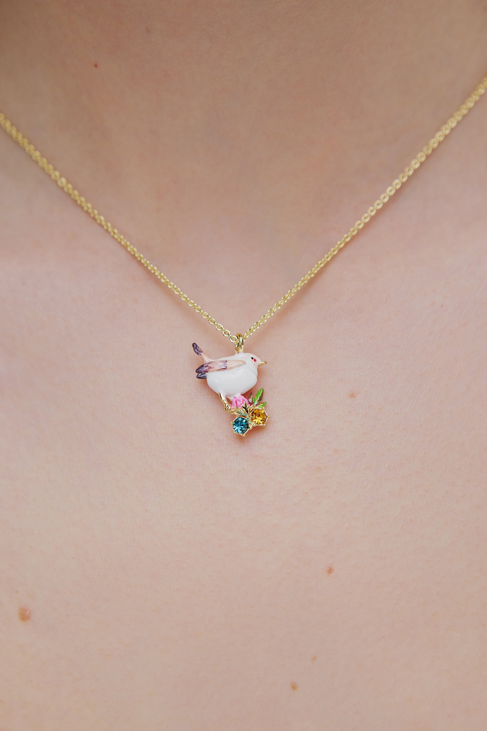 Pendant necklace with snow bunting, rosebuds and crystals