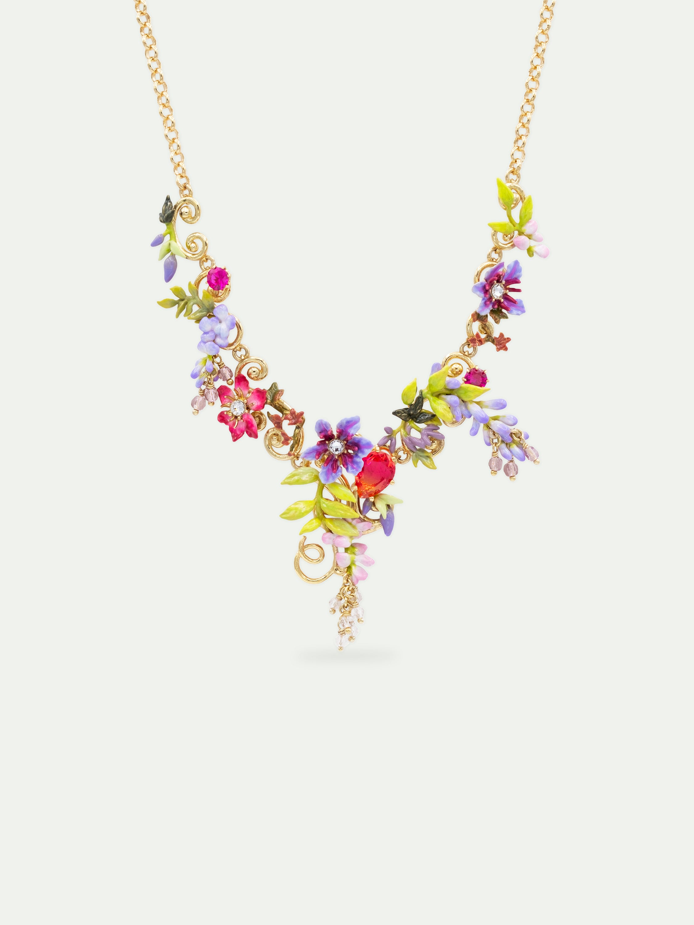 Statement necklace with pink and purple wisteria on a golden arabesque, adorned with ivy and dangling faceted pink crystal beads