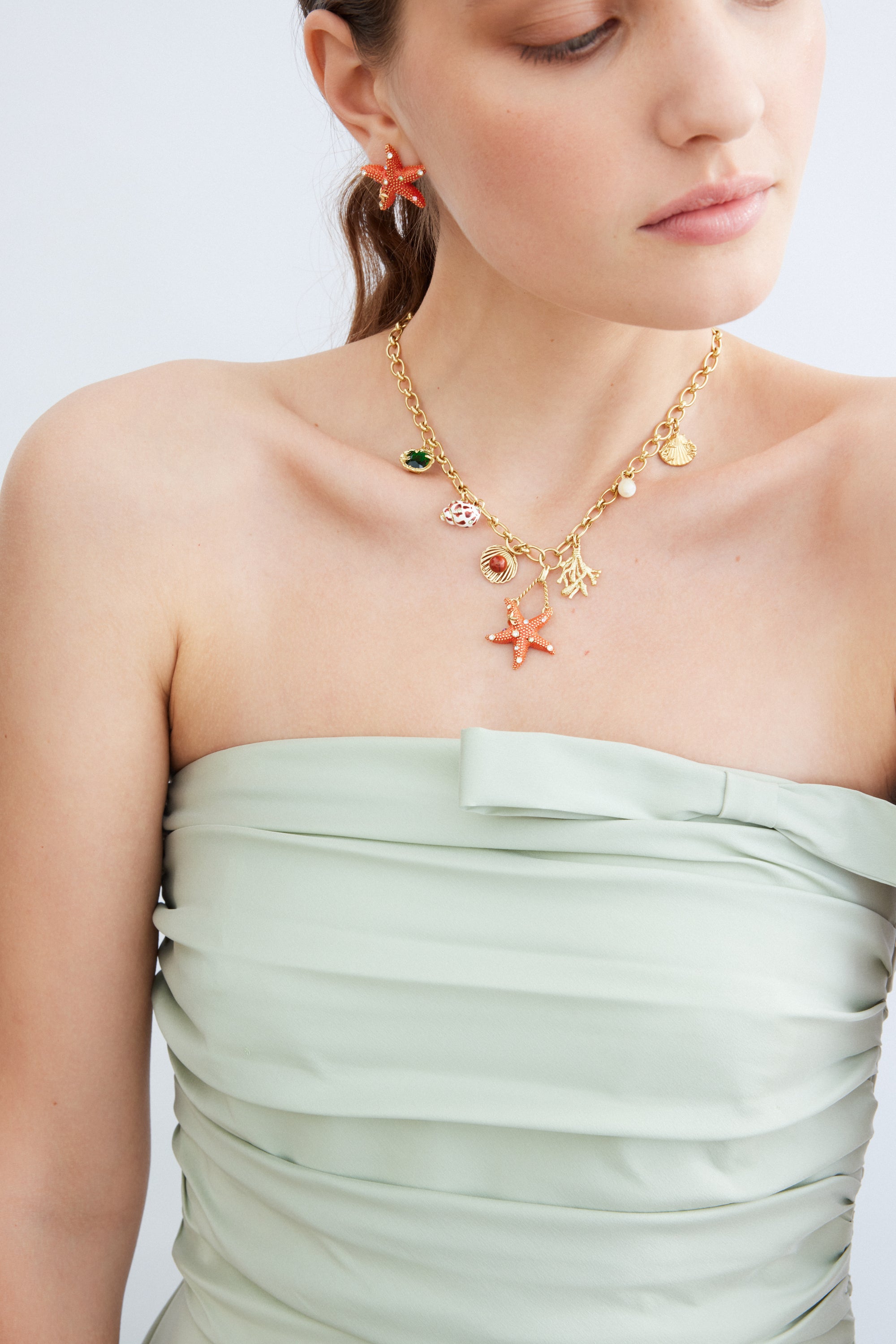 Orange starfish and multicoloured crystal earrings
