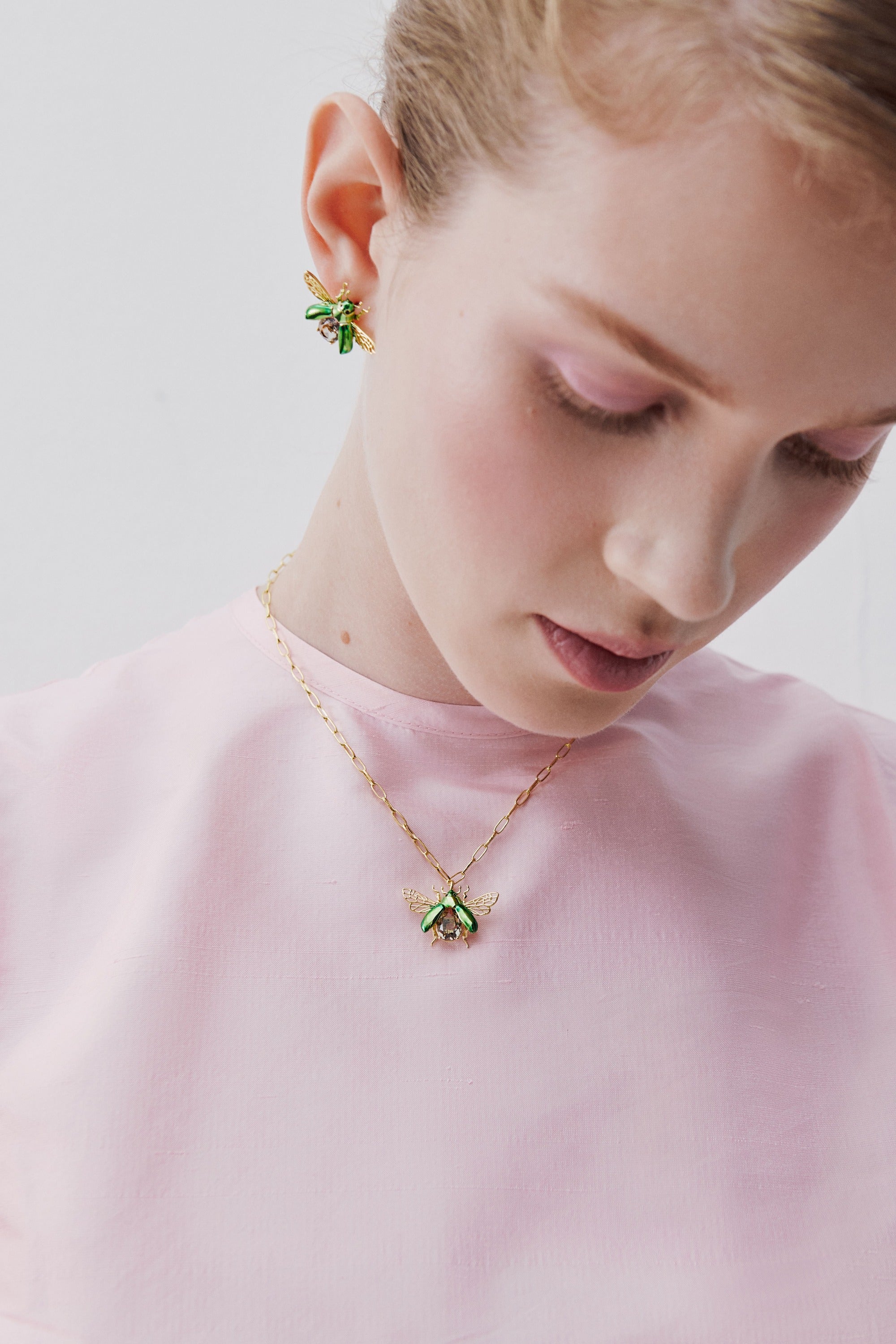 Flying green rose chafer pendant necklace with black faceted stone