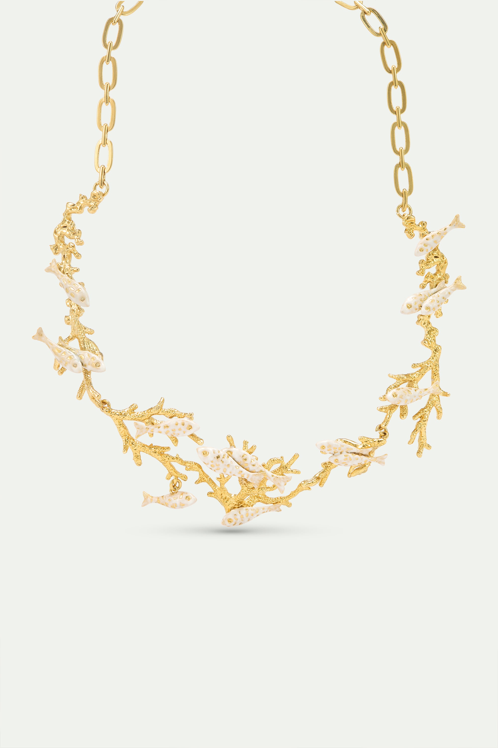 Golden coral and white fish statement necklace