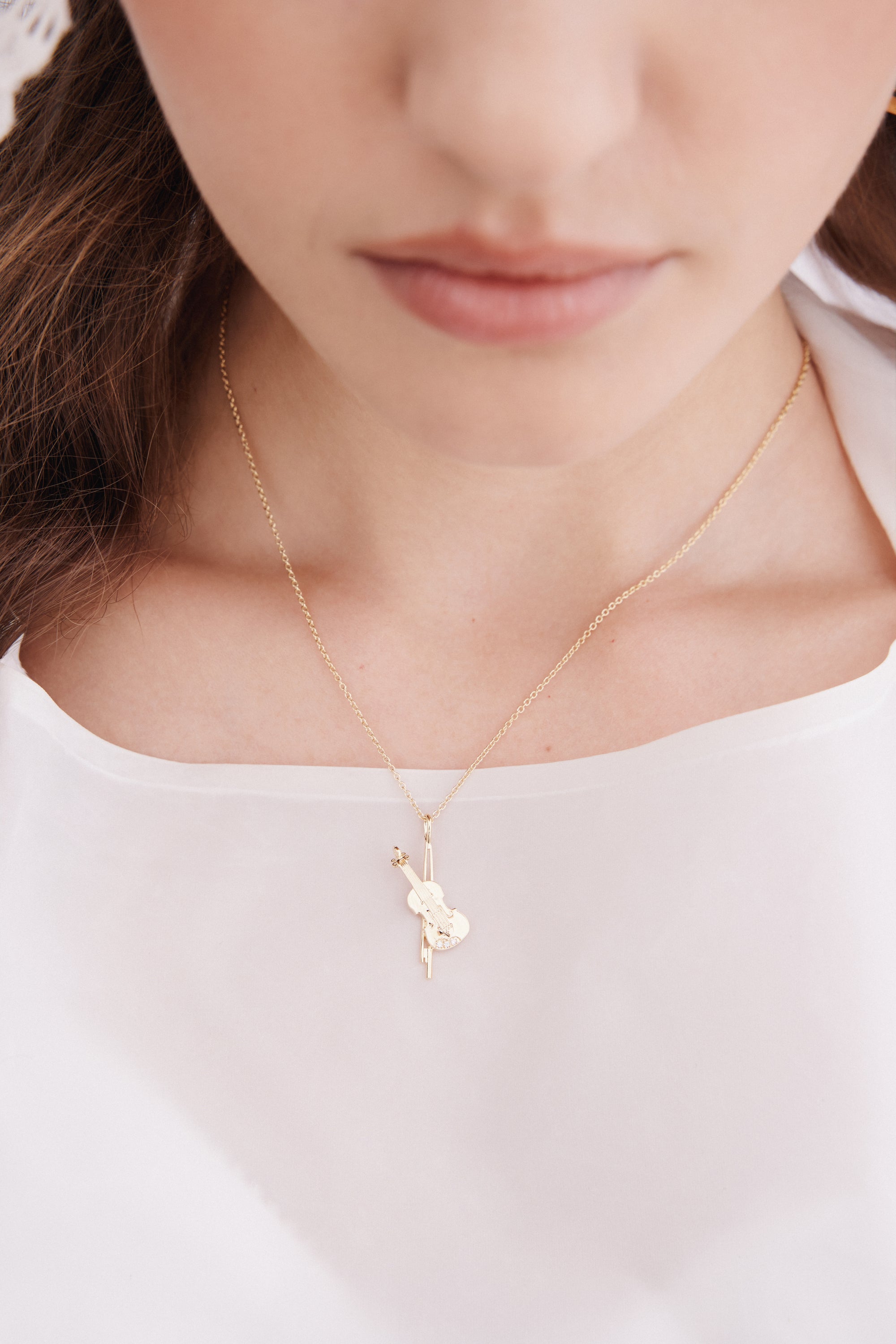 Gold cello pendant necklace
