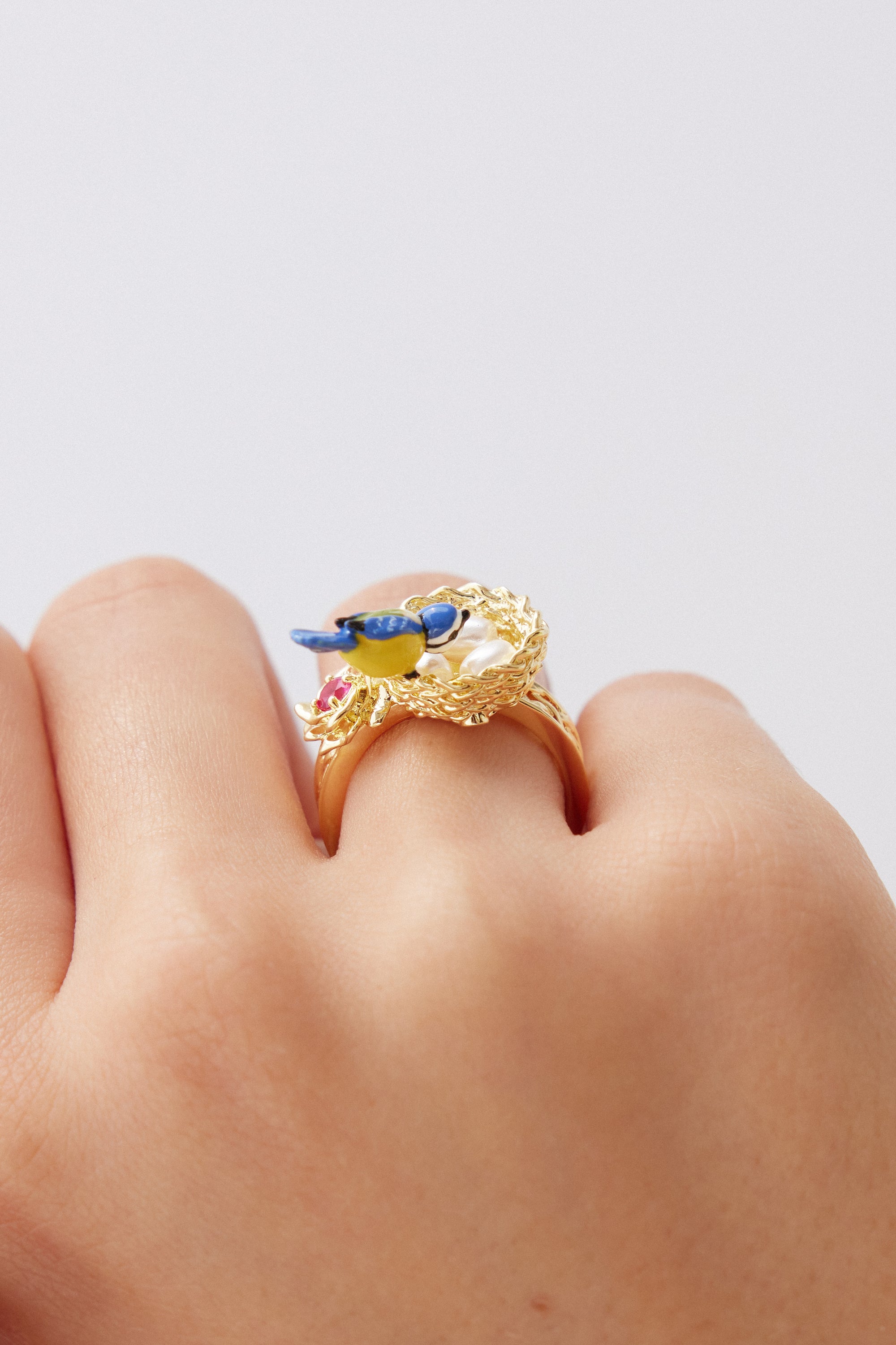 Gold nest ring with blue tit and rose