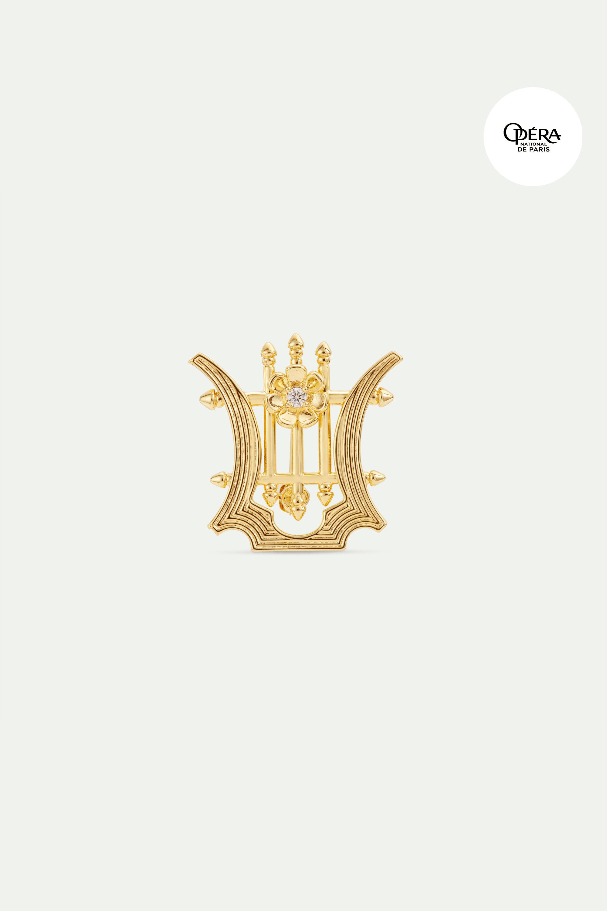 Golden lyre brooch with crystals