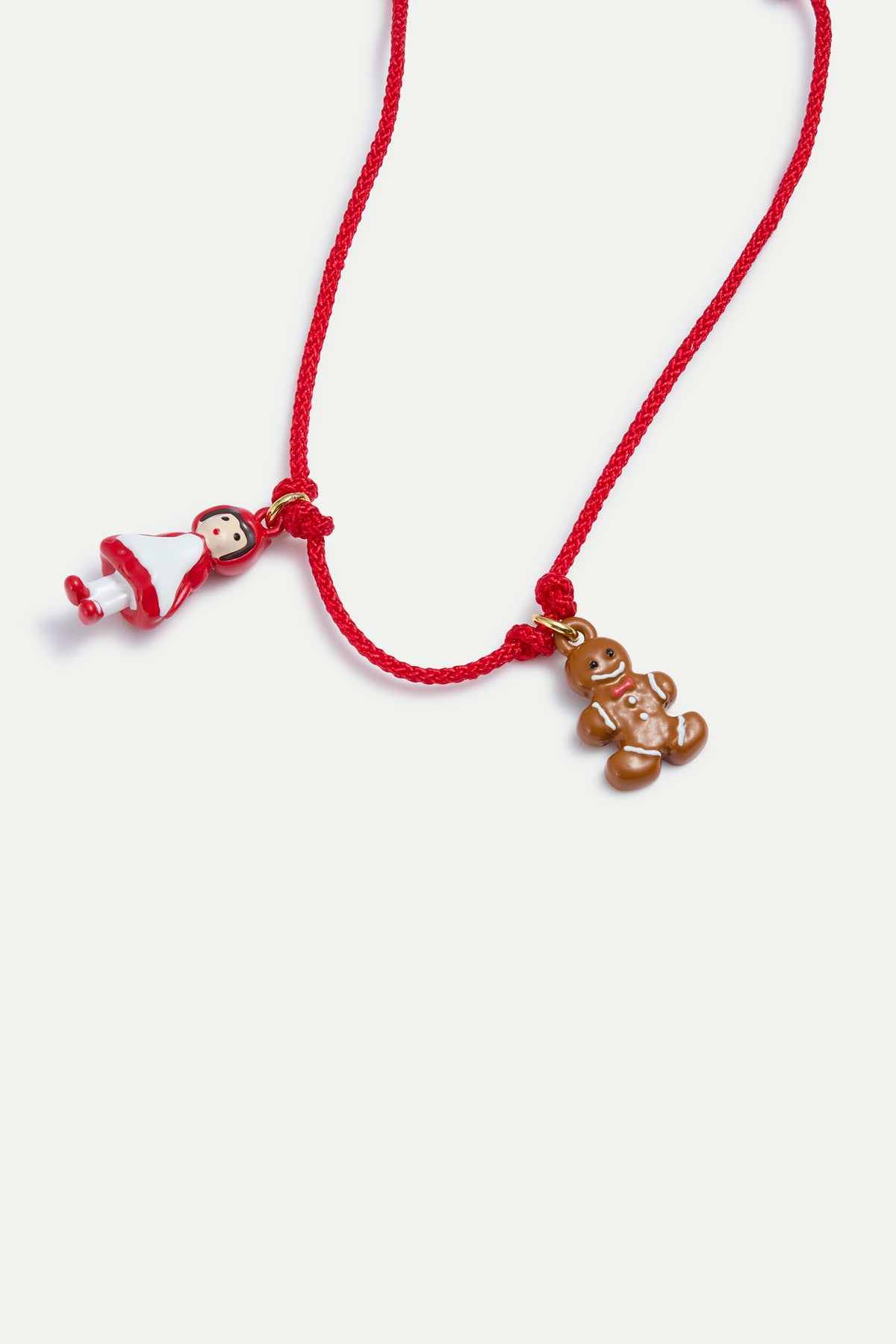 Adjustable red cord bracelet with Little Red Riding Hood and Gingerbread Man