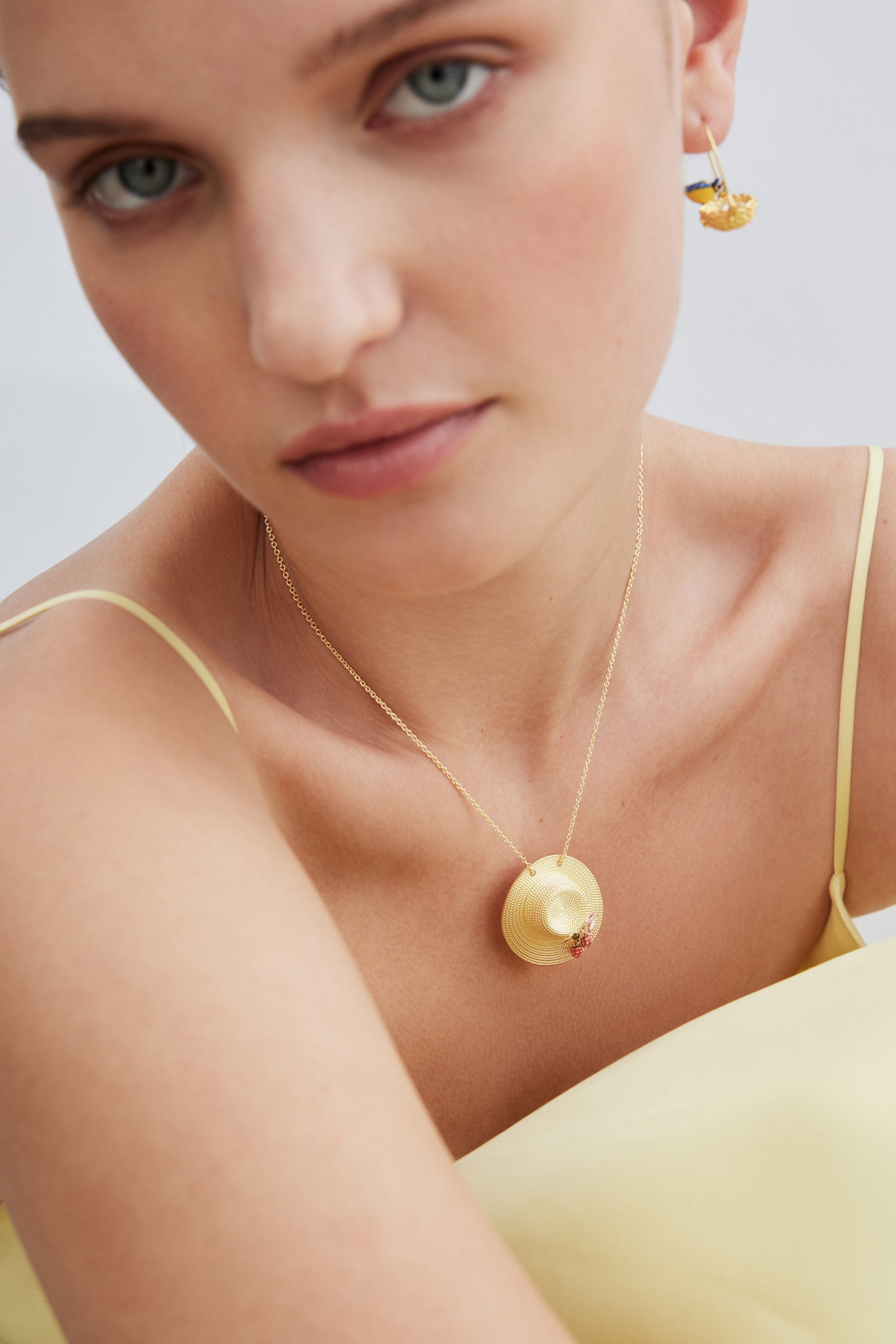 Asymmetrical hook earrings with gold nest and blue and yellow tits