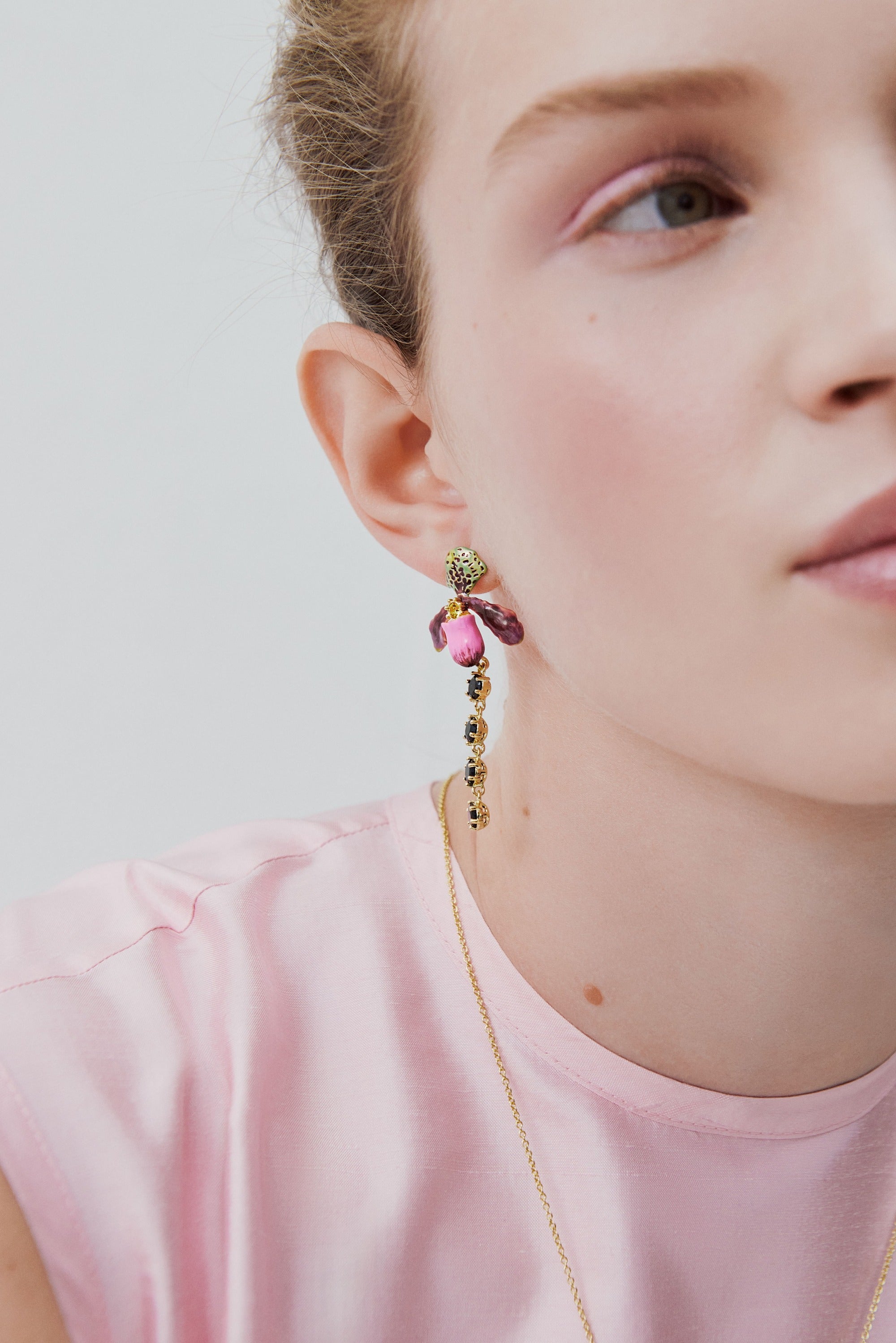 Dangle earrings with purple lady's slipper orchid and black faceted glass