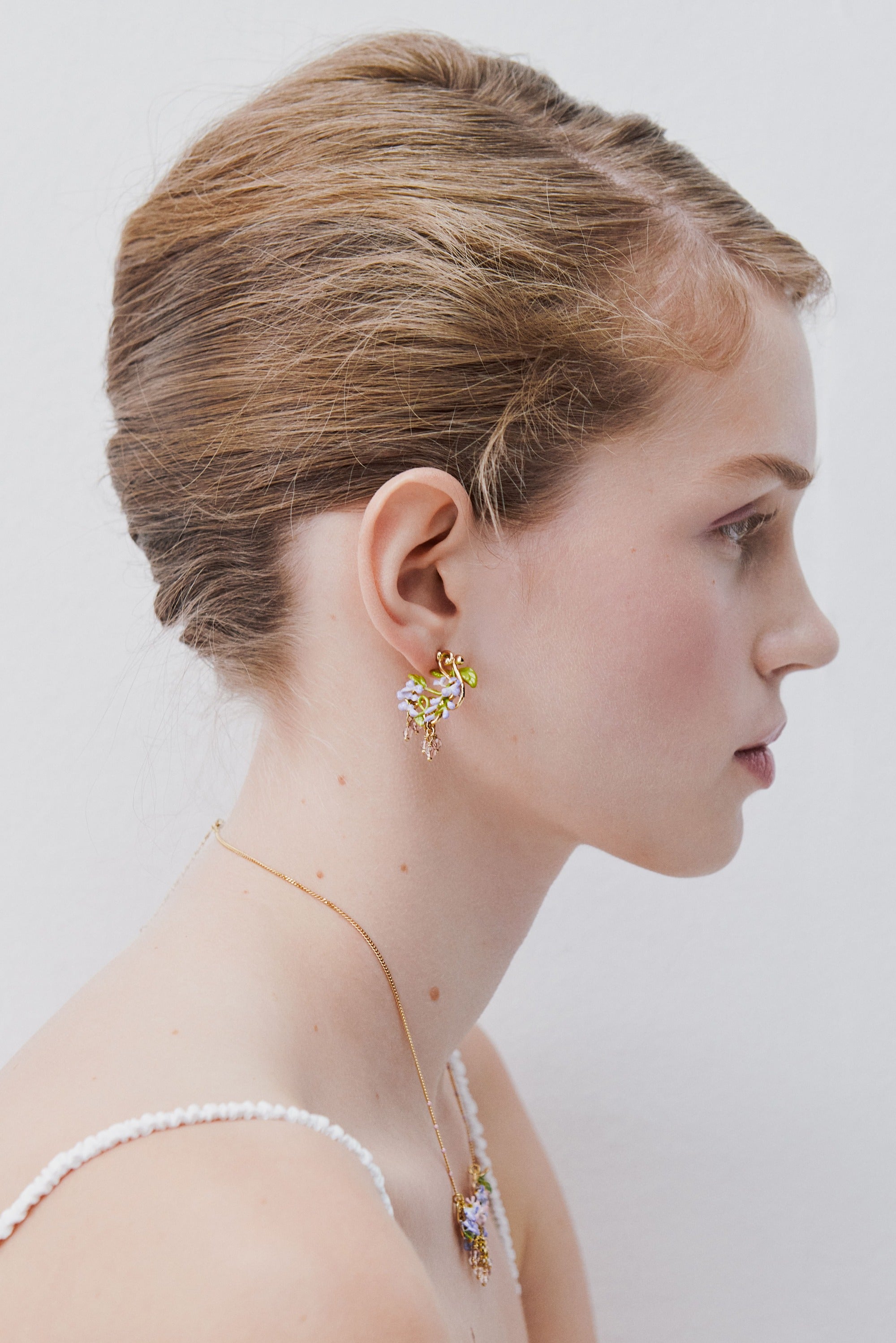 Purple wisteria post earrings on golden arabesque, ivy and faceted crystal beads