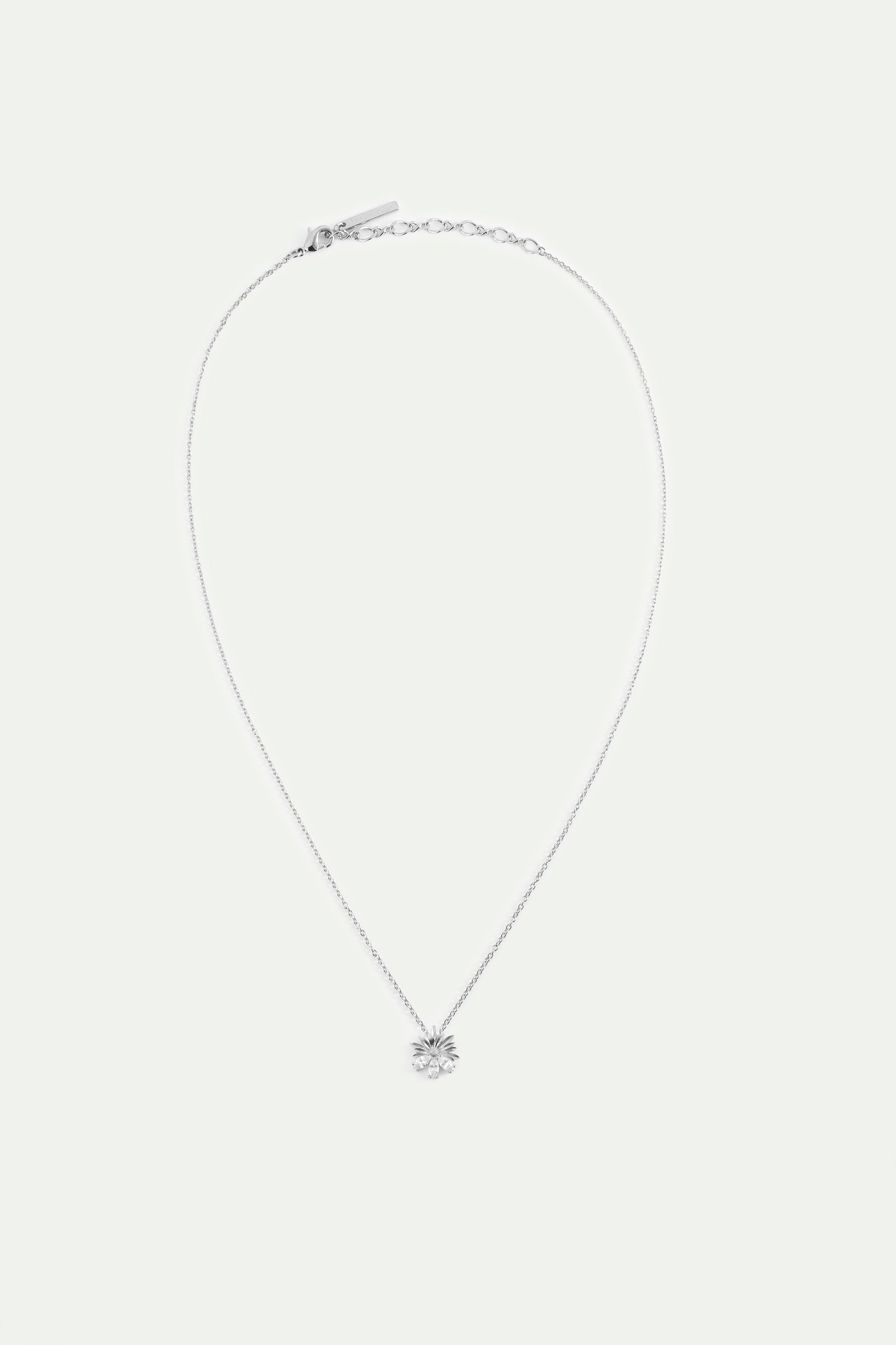 Silver pendant necklace with daisies and white stones
