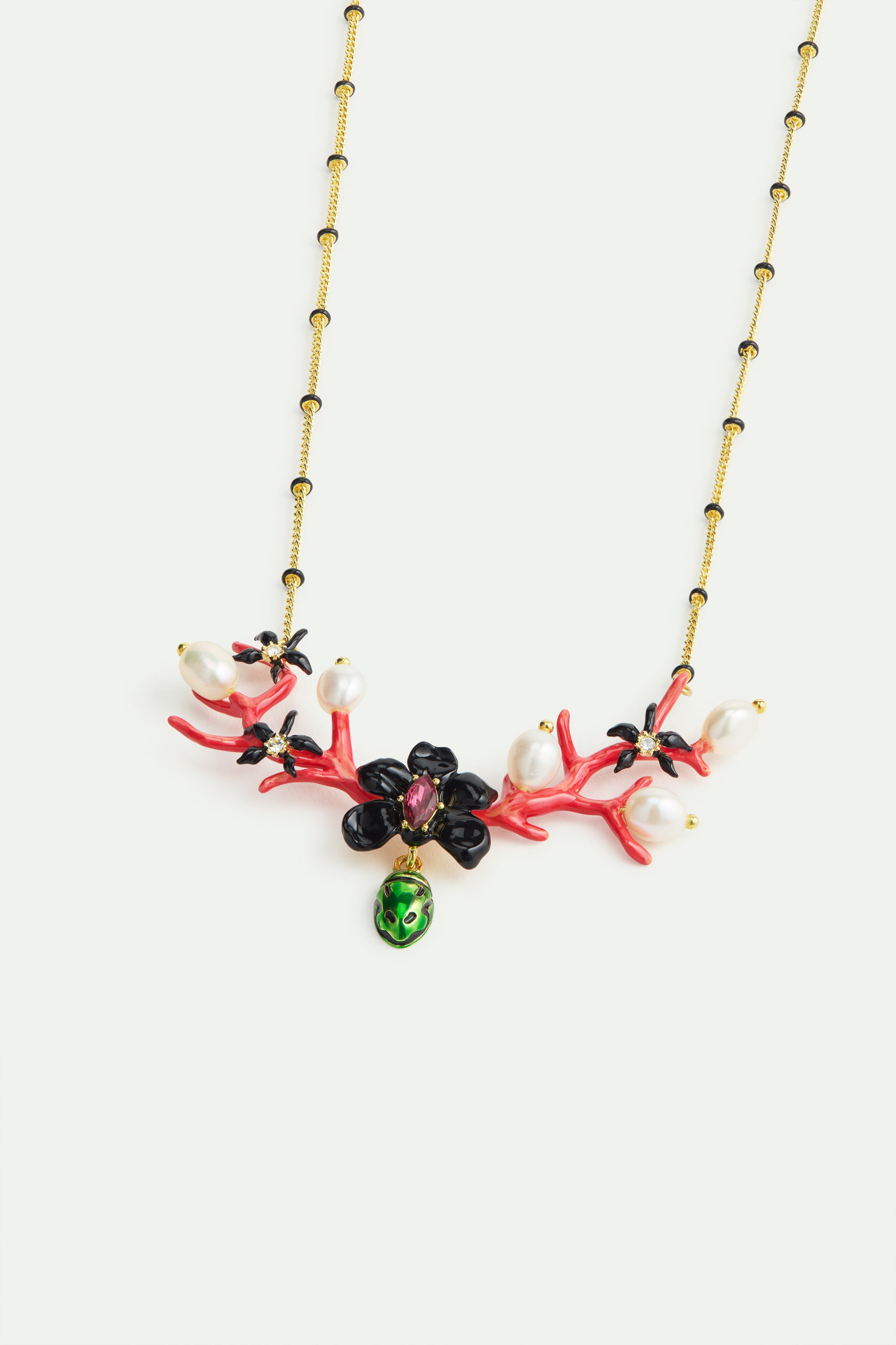 Statement necklace with black orchid, red coral, dangling green rose chafer and cultured pearls