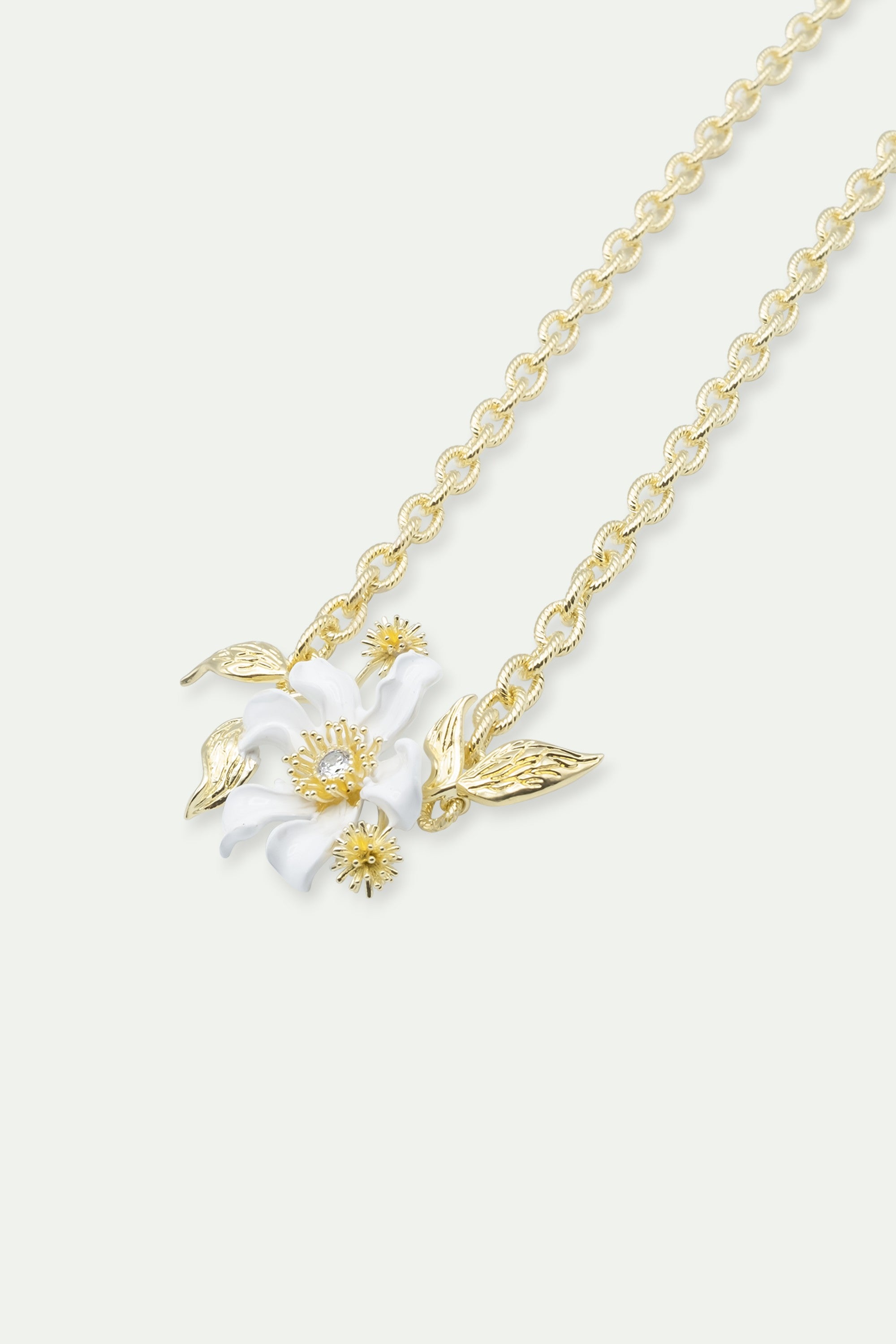 Large white clematis flower, Japanese kerria and laurel necklace