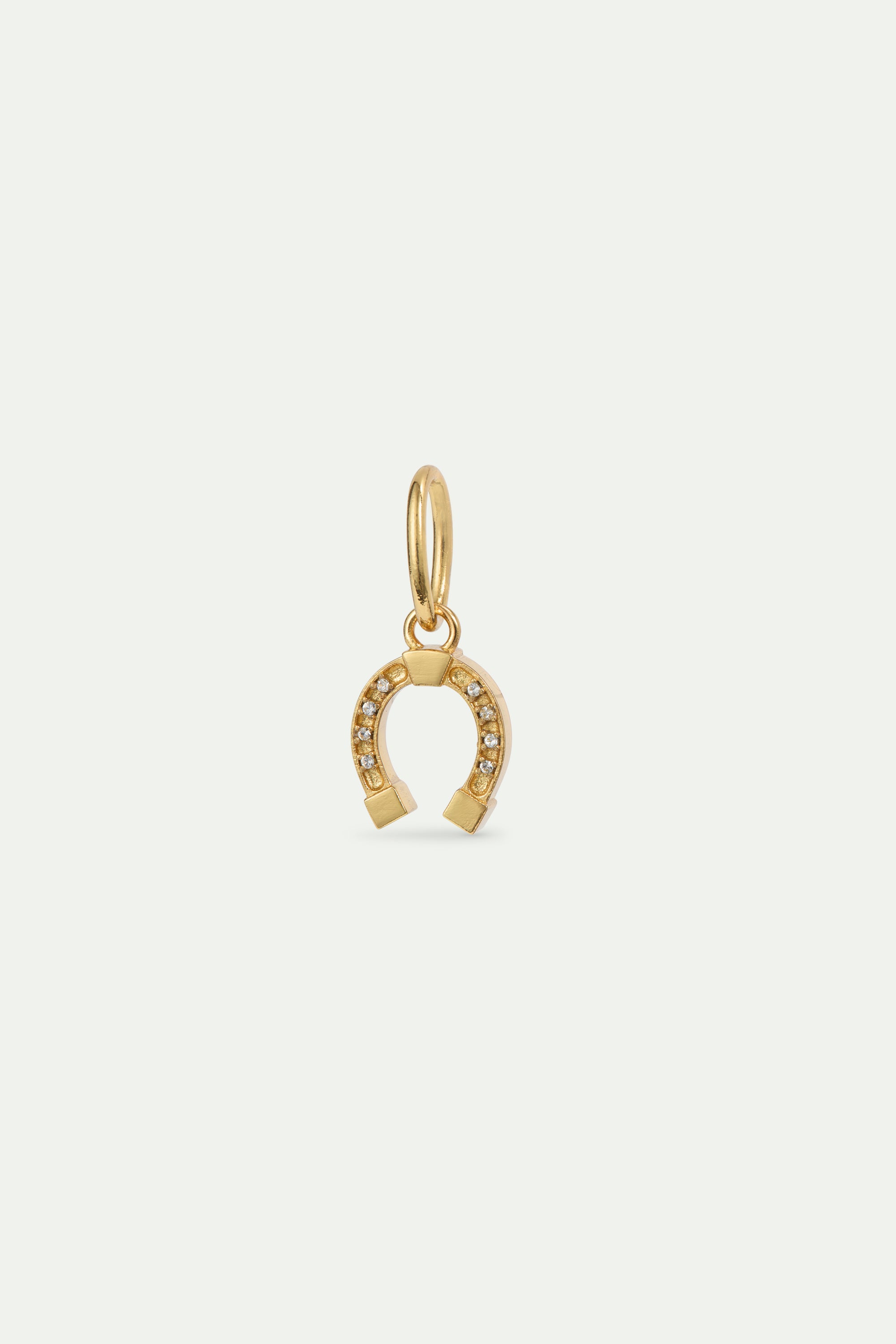 Gold-plated horseshoe pendant, Conjuring and Abnegation