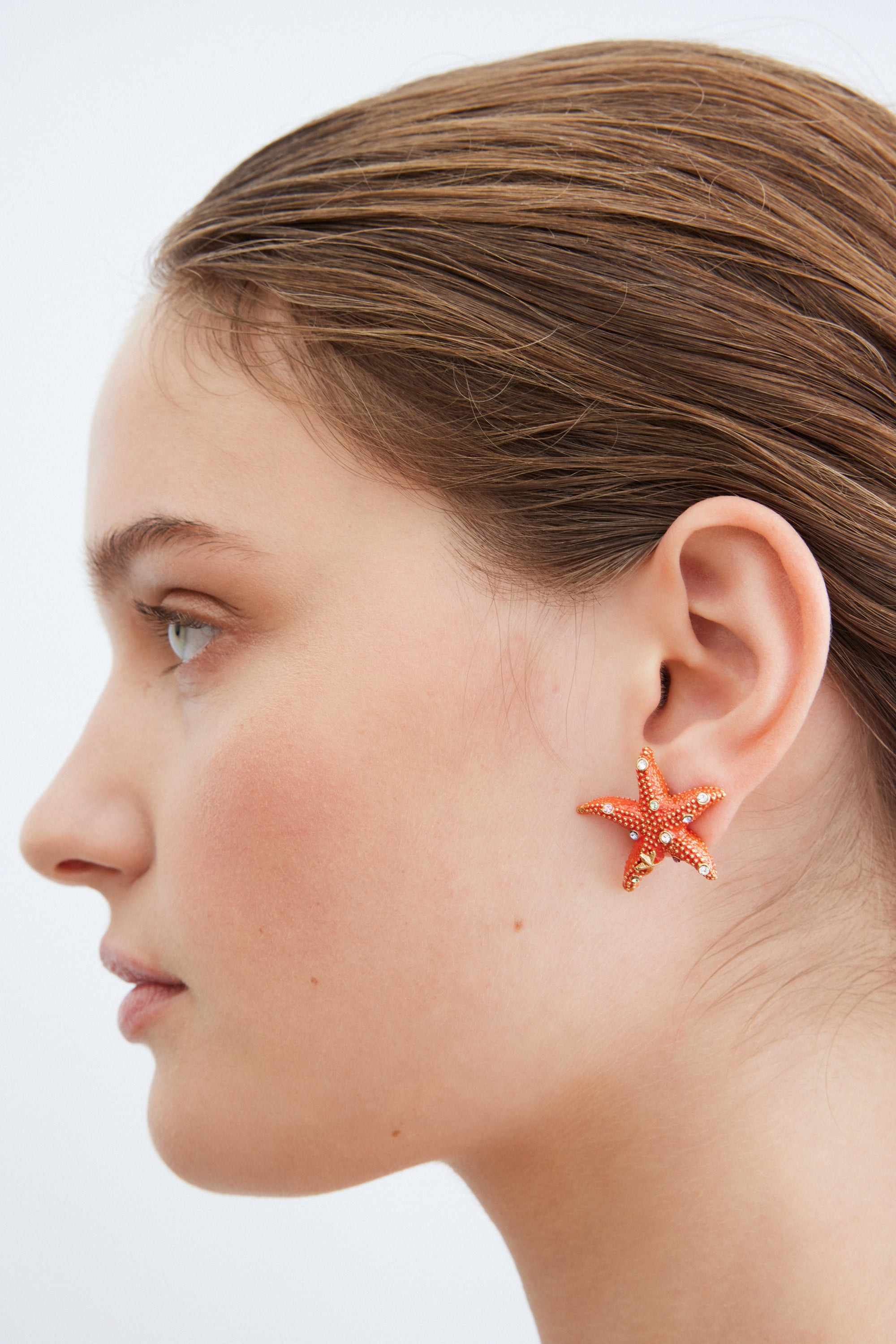 Orange starfish and multicoloured crystal earrings