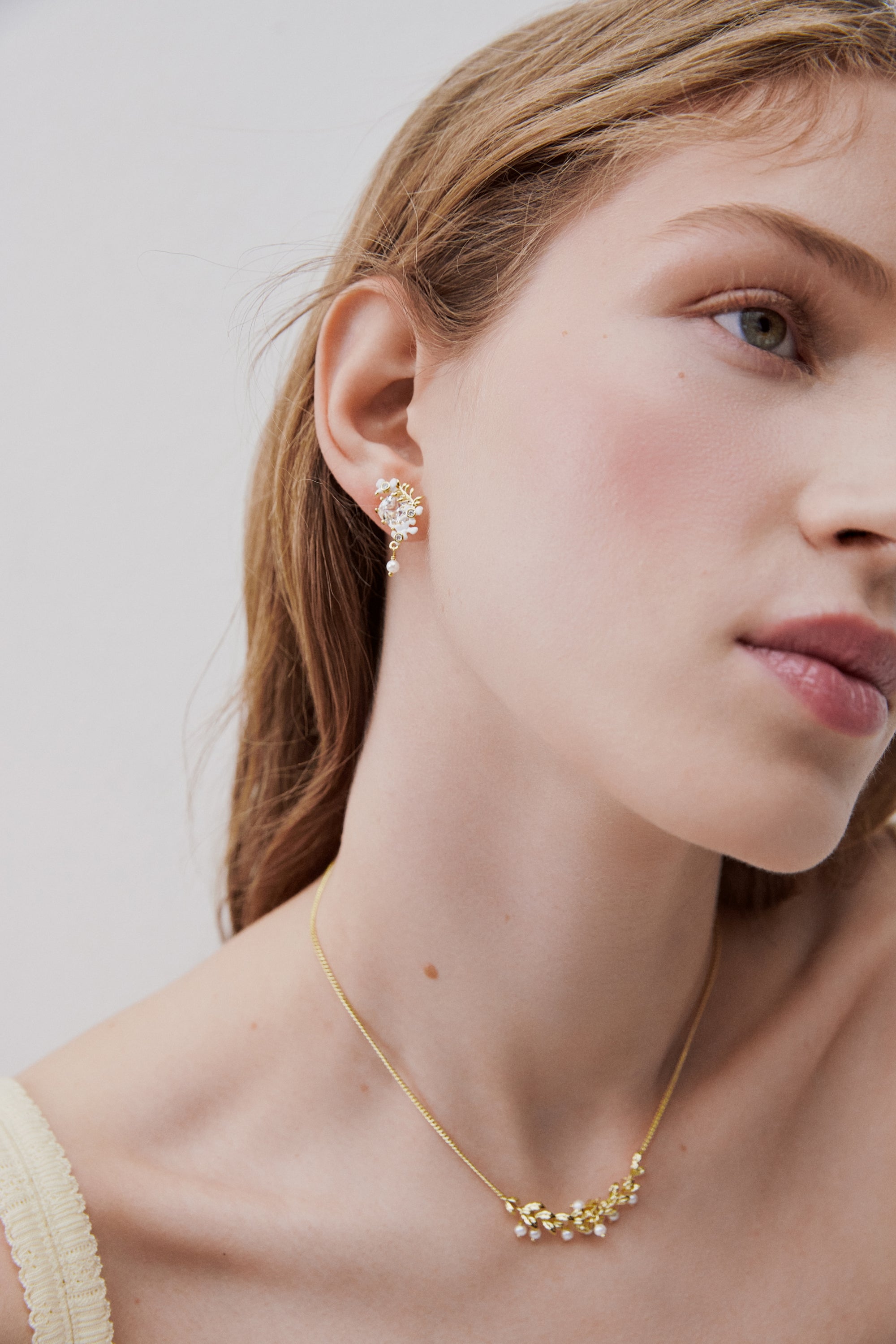 Faceted stone post earrings with clematis flower and Japanese kerria, golden laurel, white wisteria and cultured pearl