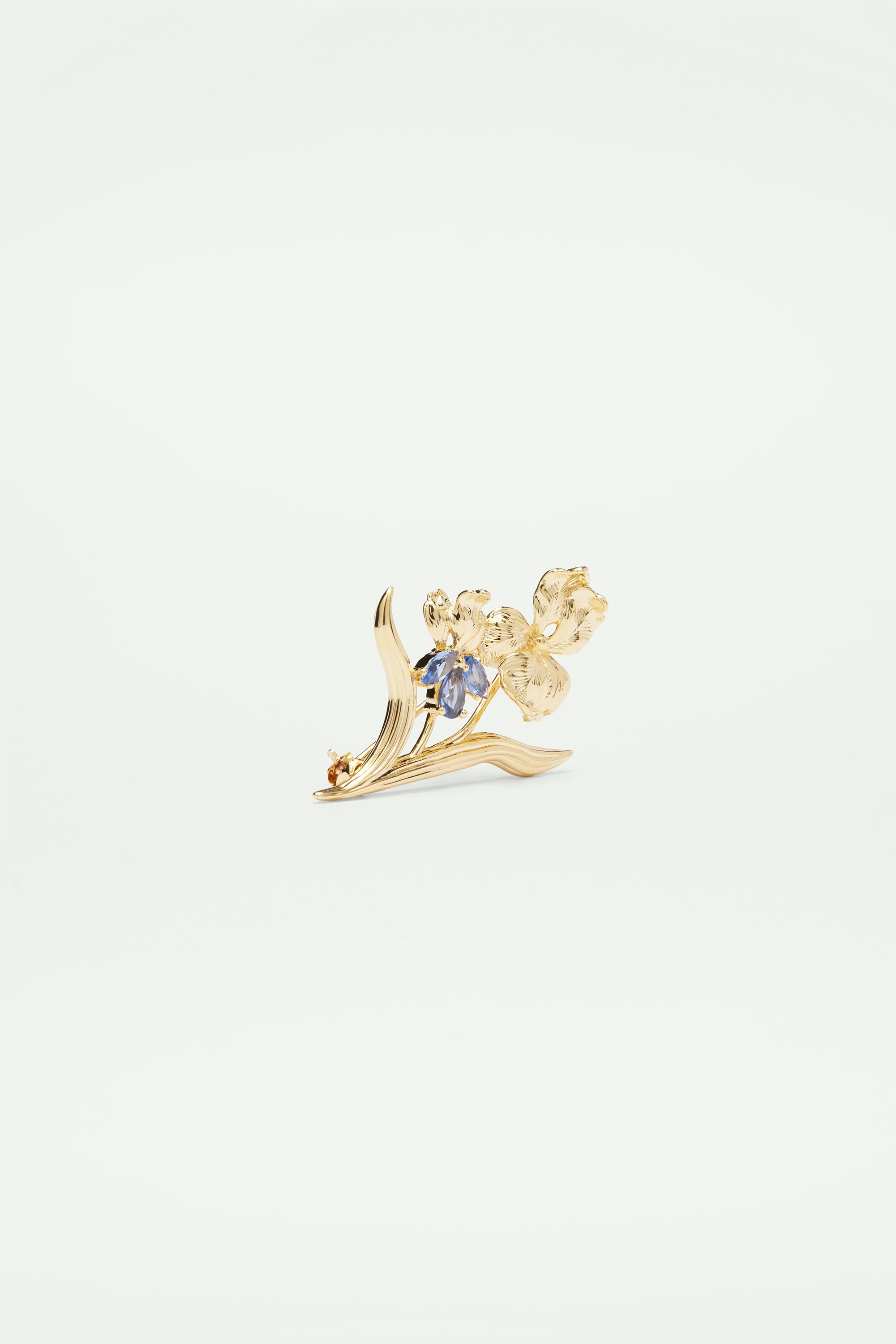 Gold iris and blue crystal brooch