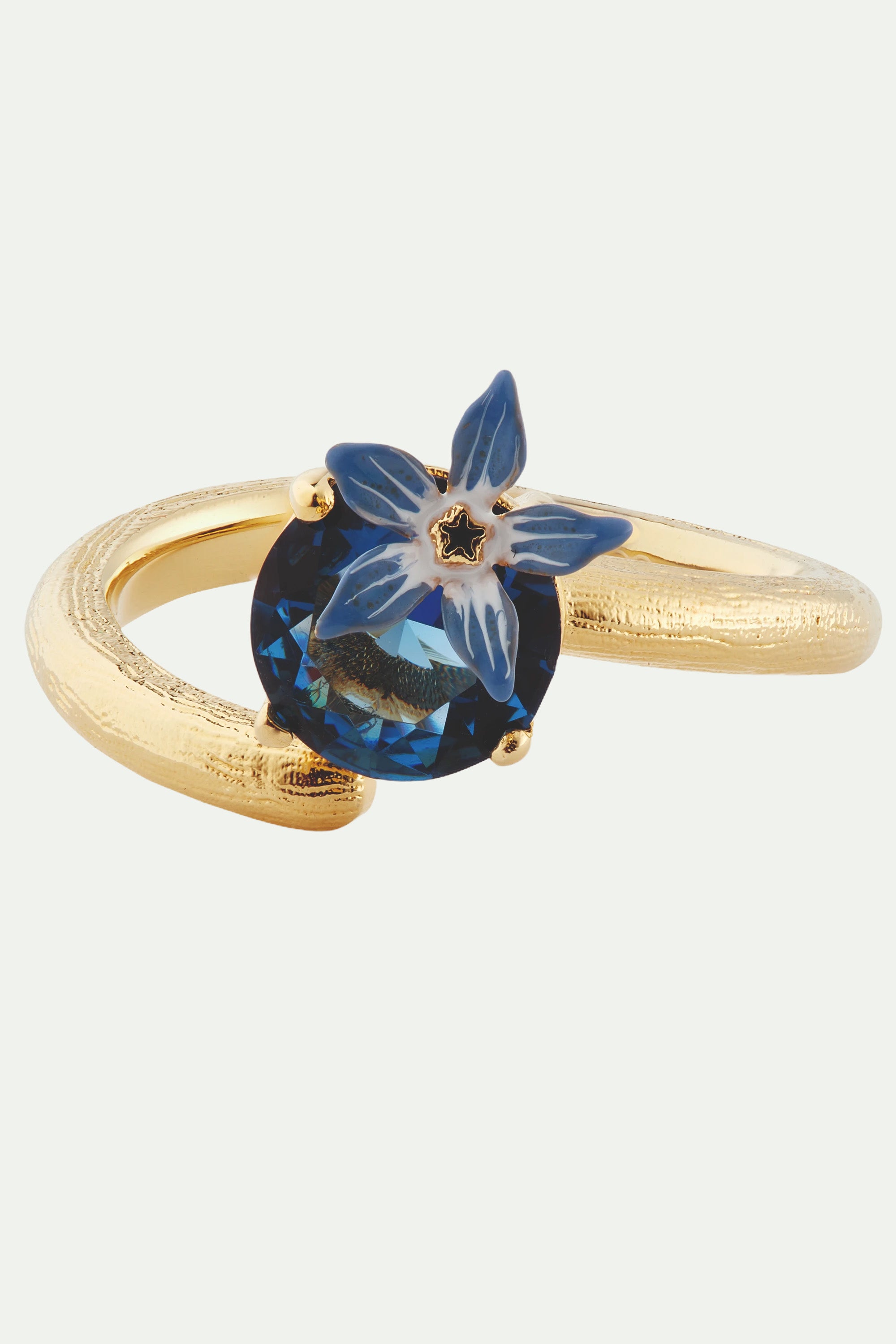 Anillo ajustable flor azul y cristal en facetas redondo