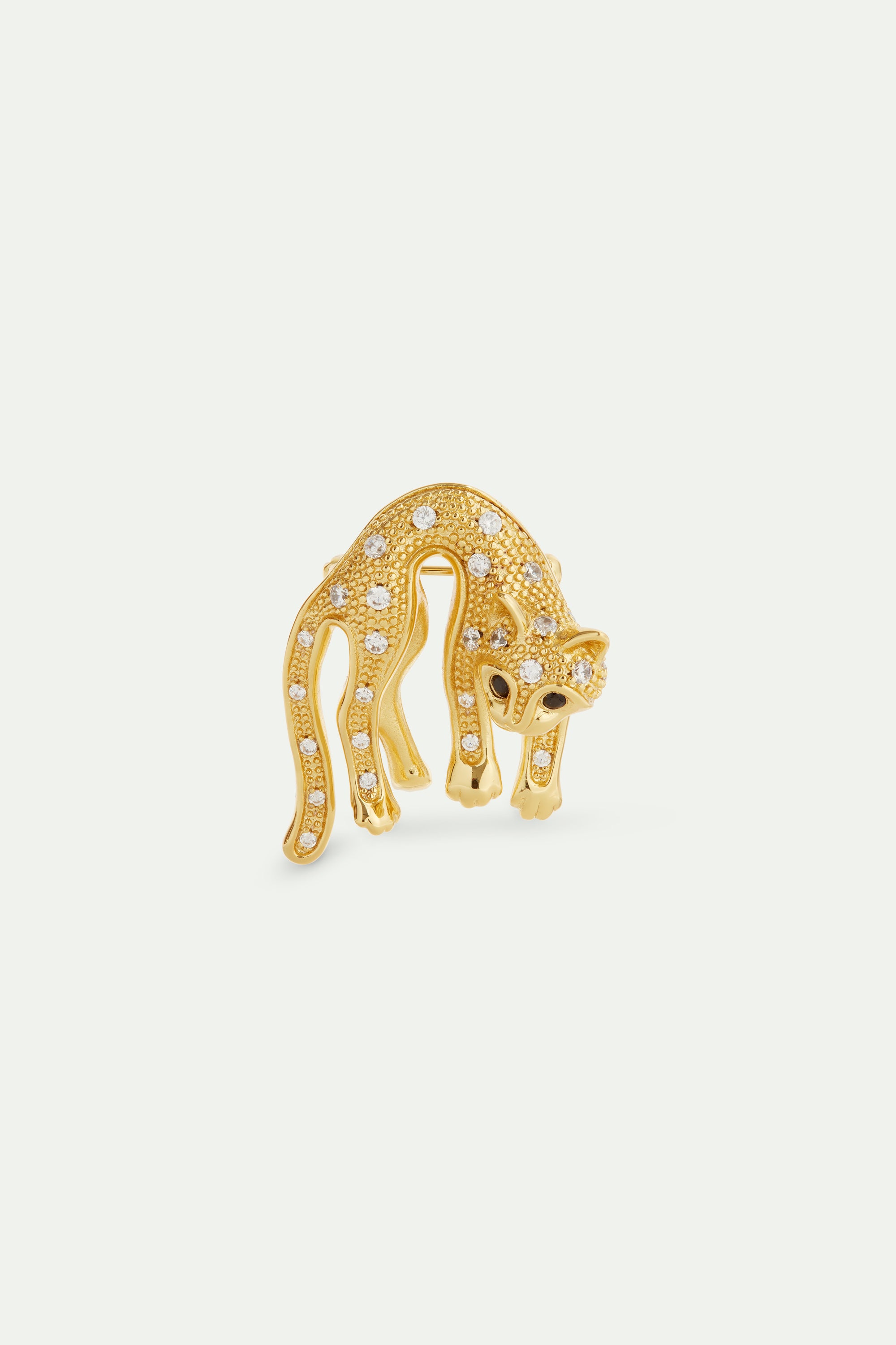 Golden cat and crystal brooch