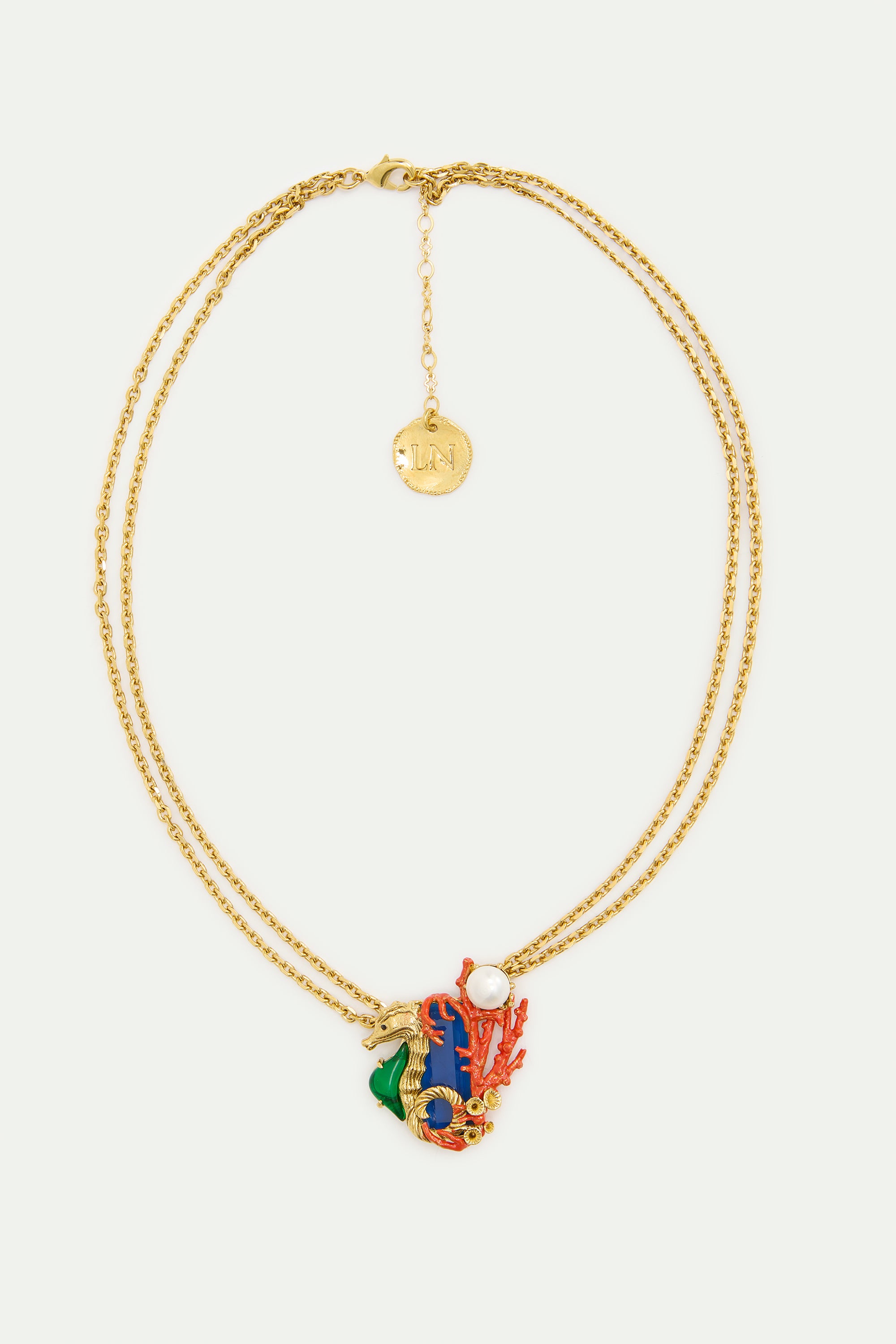 Collar piedra azul marino y caballito de mar verde y dorado