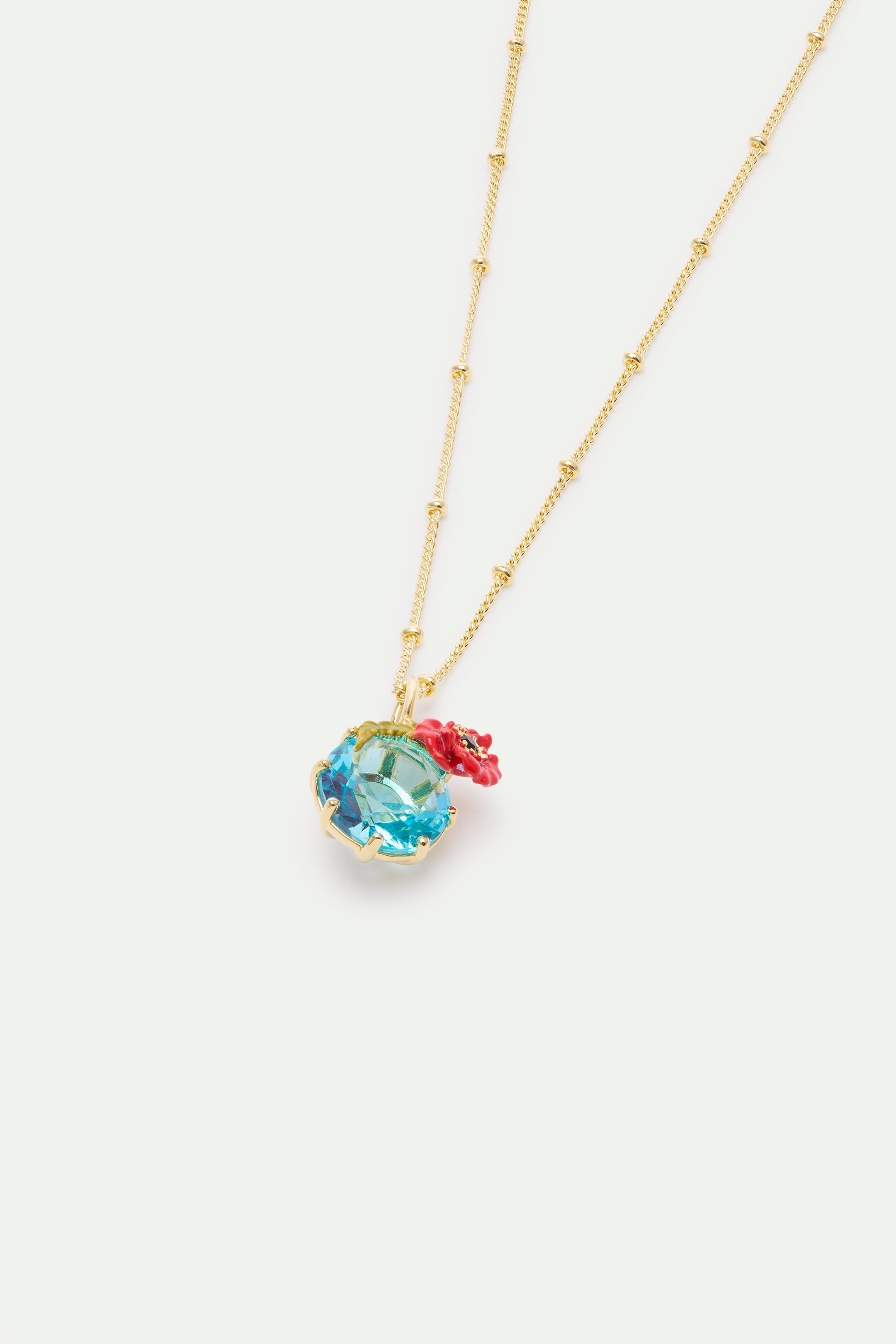 Collar con colgante de piedra redonda azul y amapola