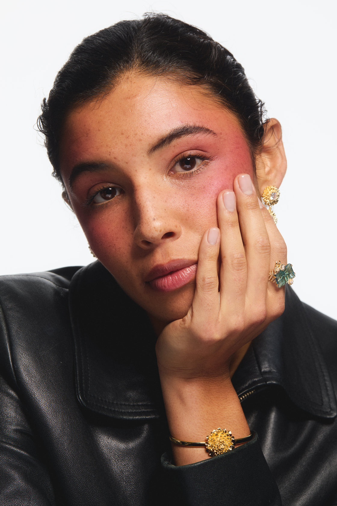 Blue cut stone and golden flower ring