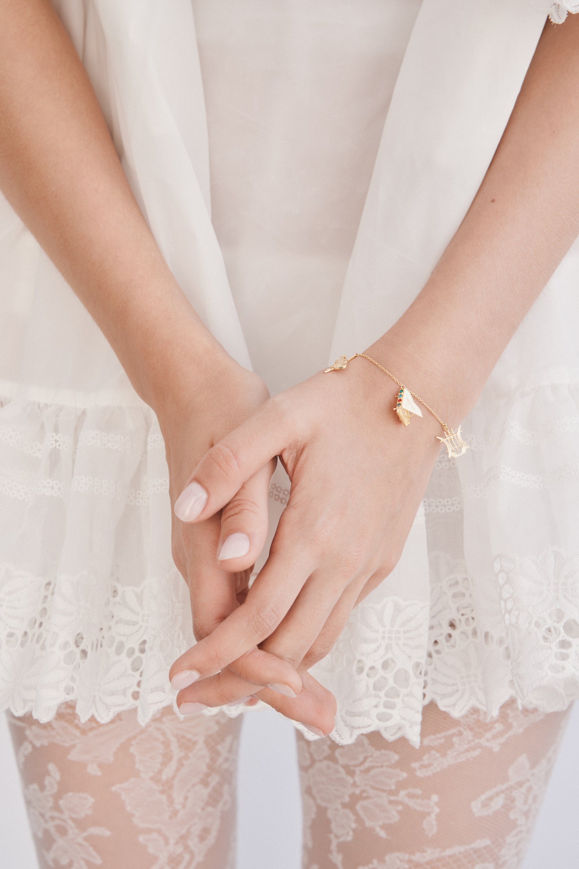 Gold musical instrument charm bracelet