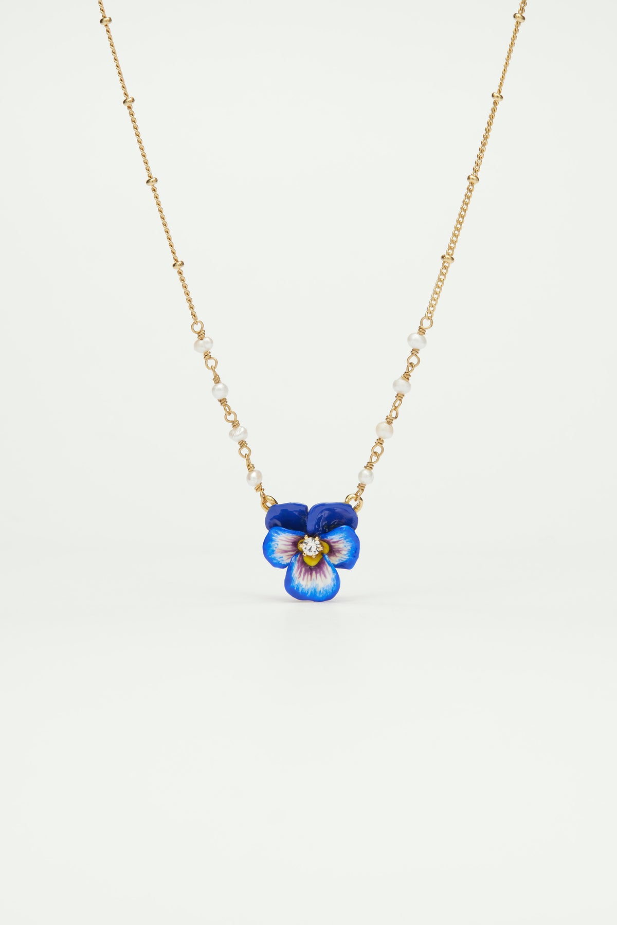 Blue pansy and faceted crystal pendant necklace