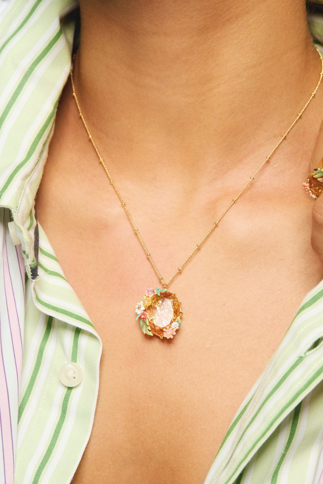 Oval pink faceted stone pendant necklace with zinnias and daisies