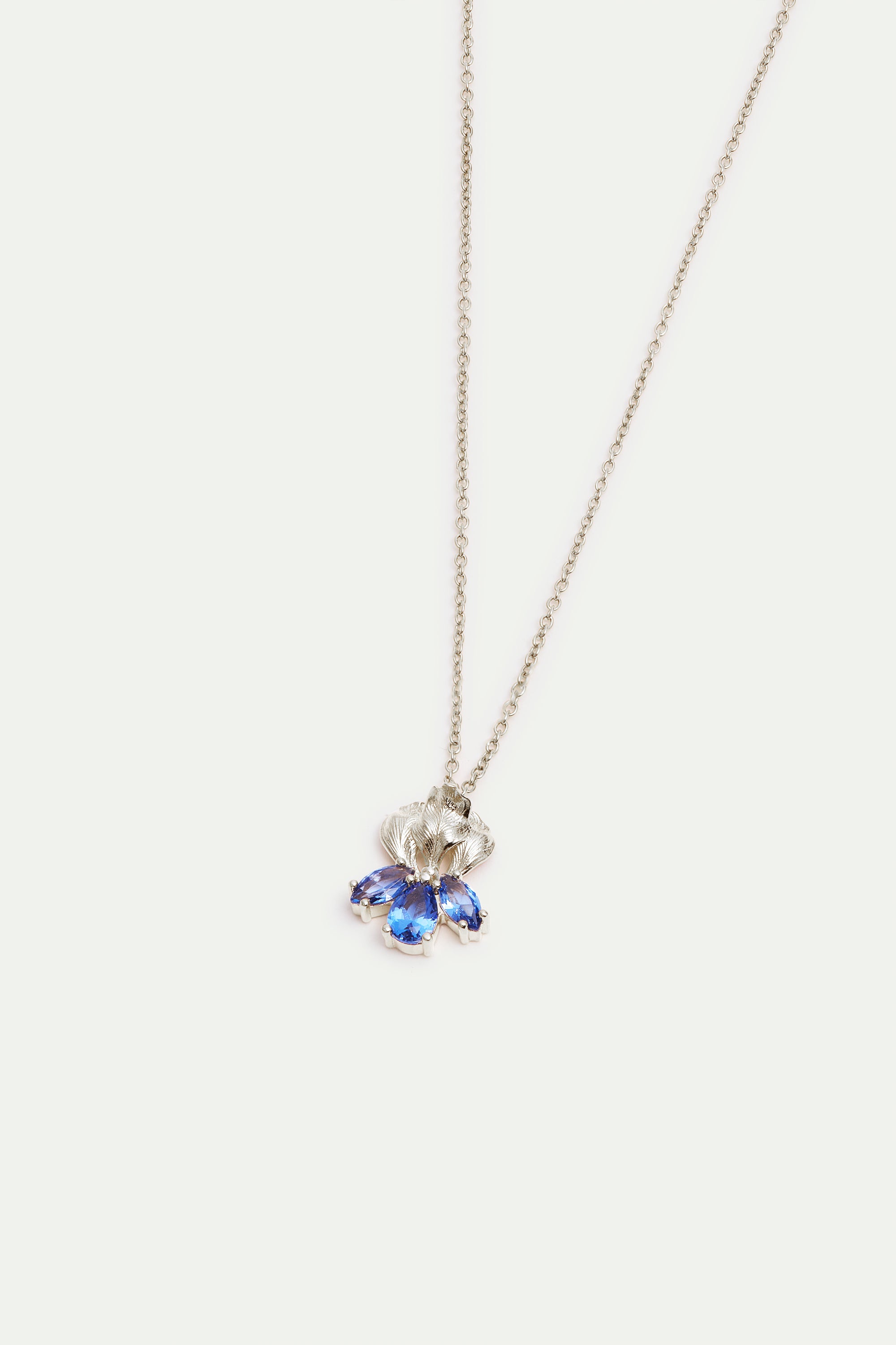Silver iris and blue stone pendant necklace