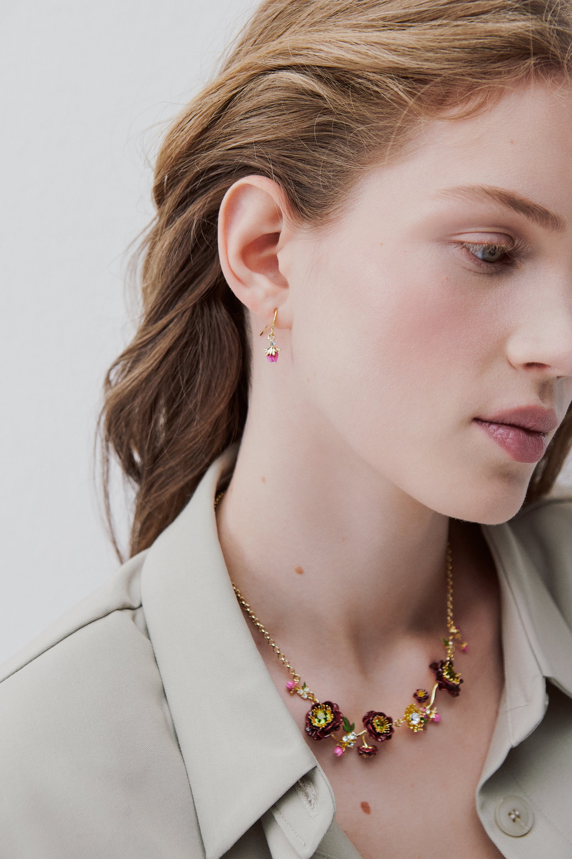 Statement necklace with burgundy anemone flowers, rose buds and green faceted stones