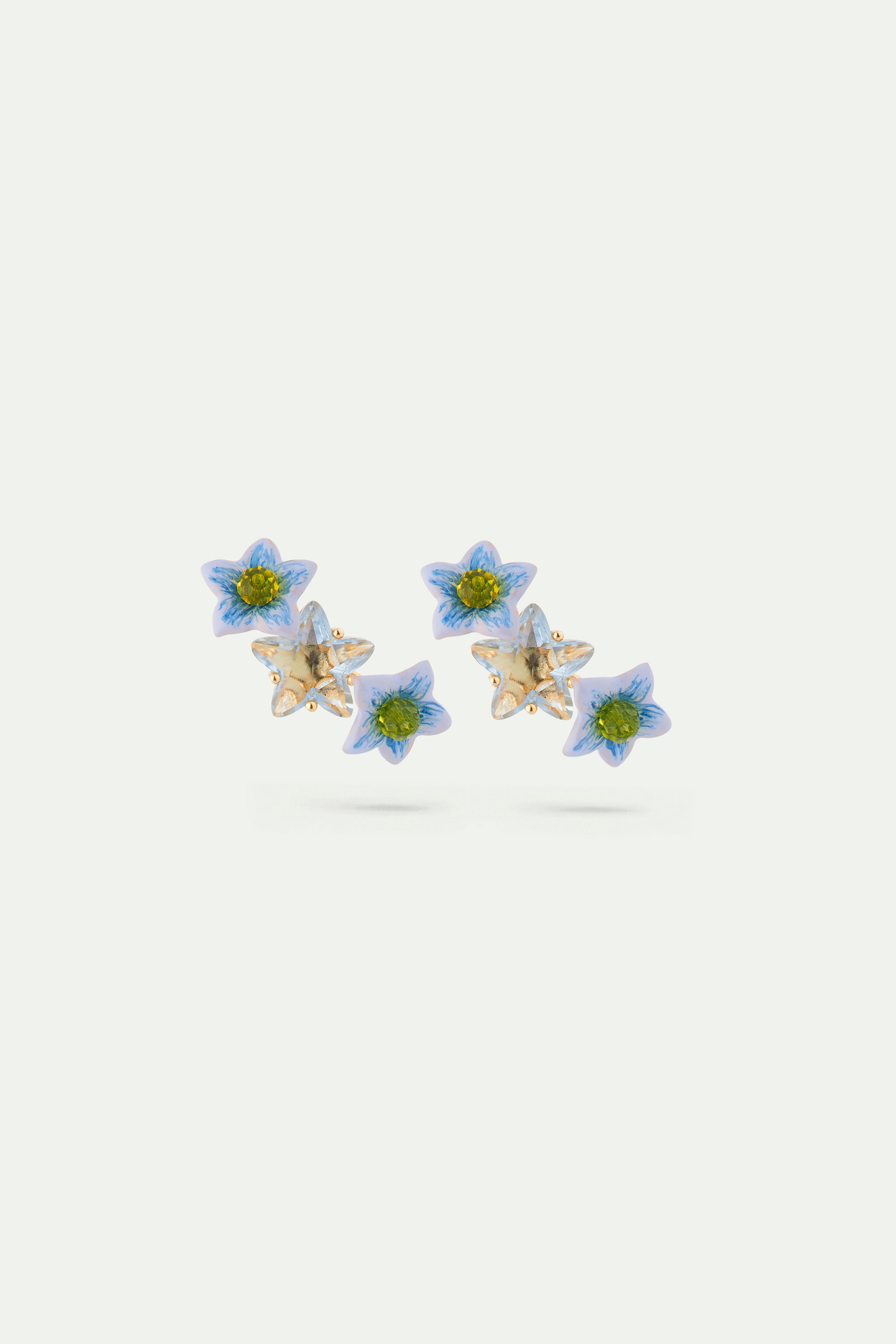 Asymmetrical faceted star and jasmine flower Post earrings