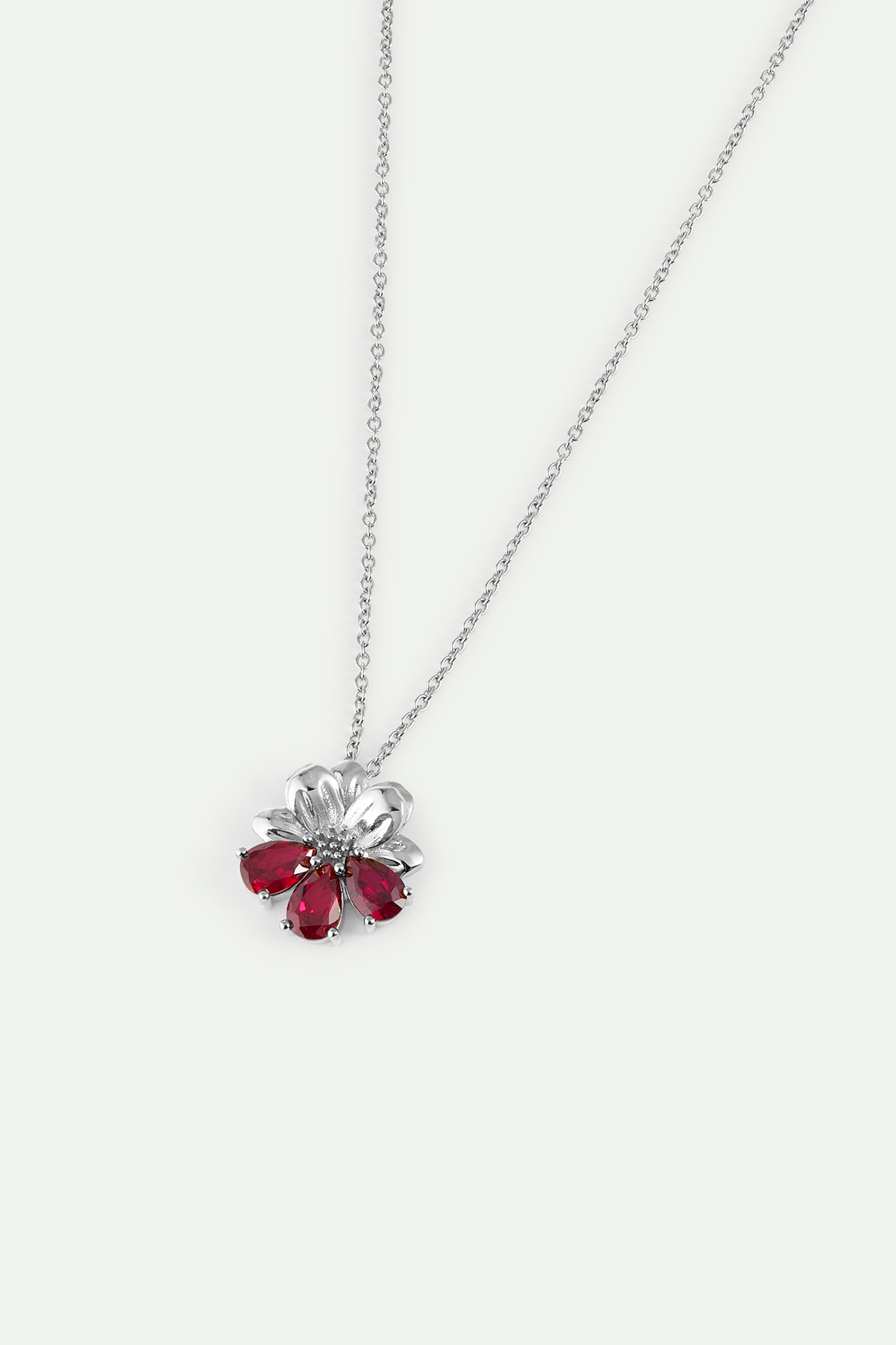 Silver pendant necklace with cosmos and red stones
