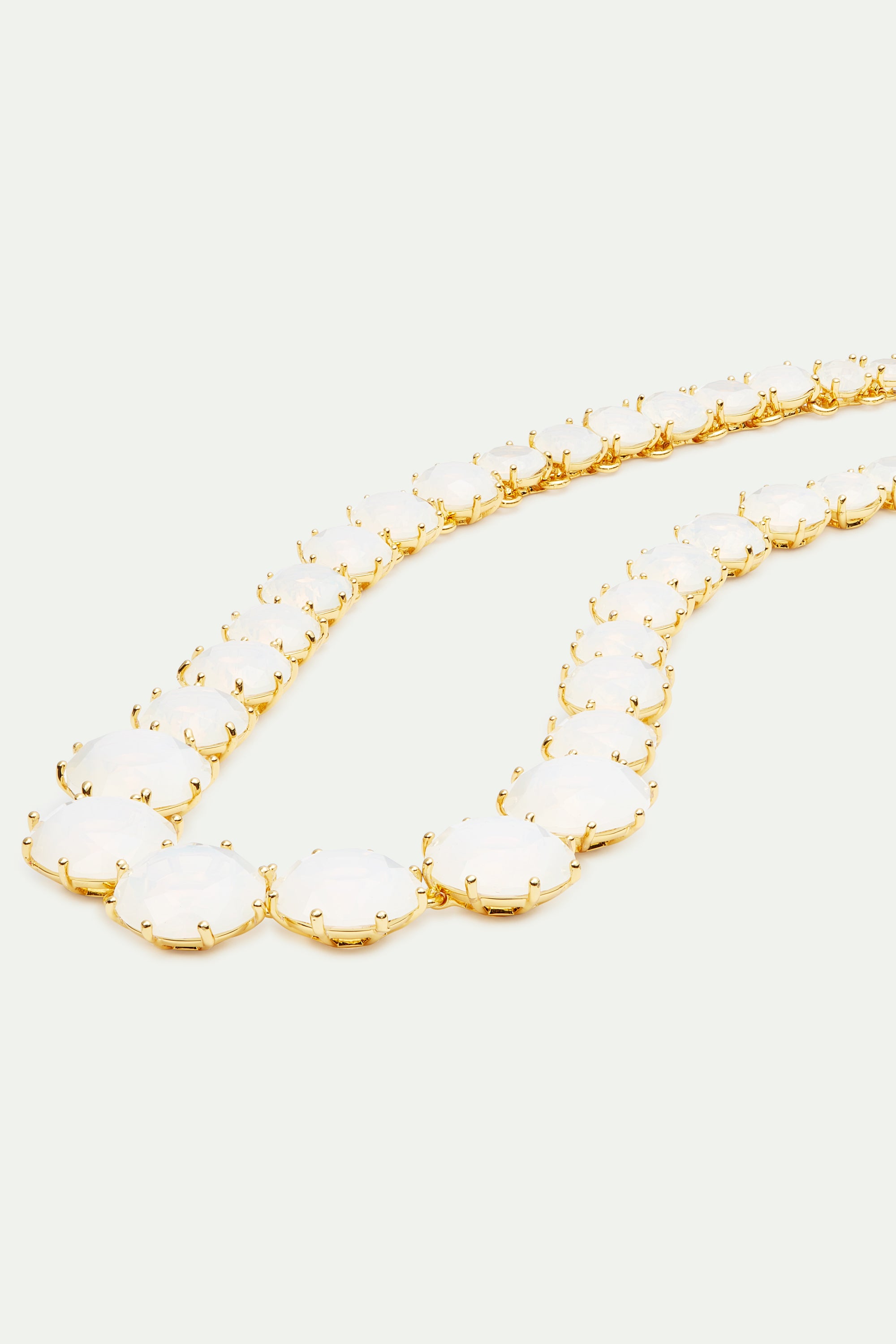 Opalescent white Diamantine round stone long necklace