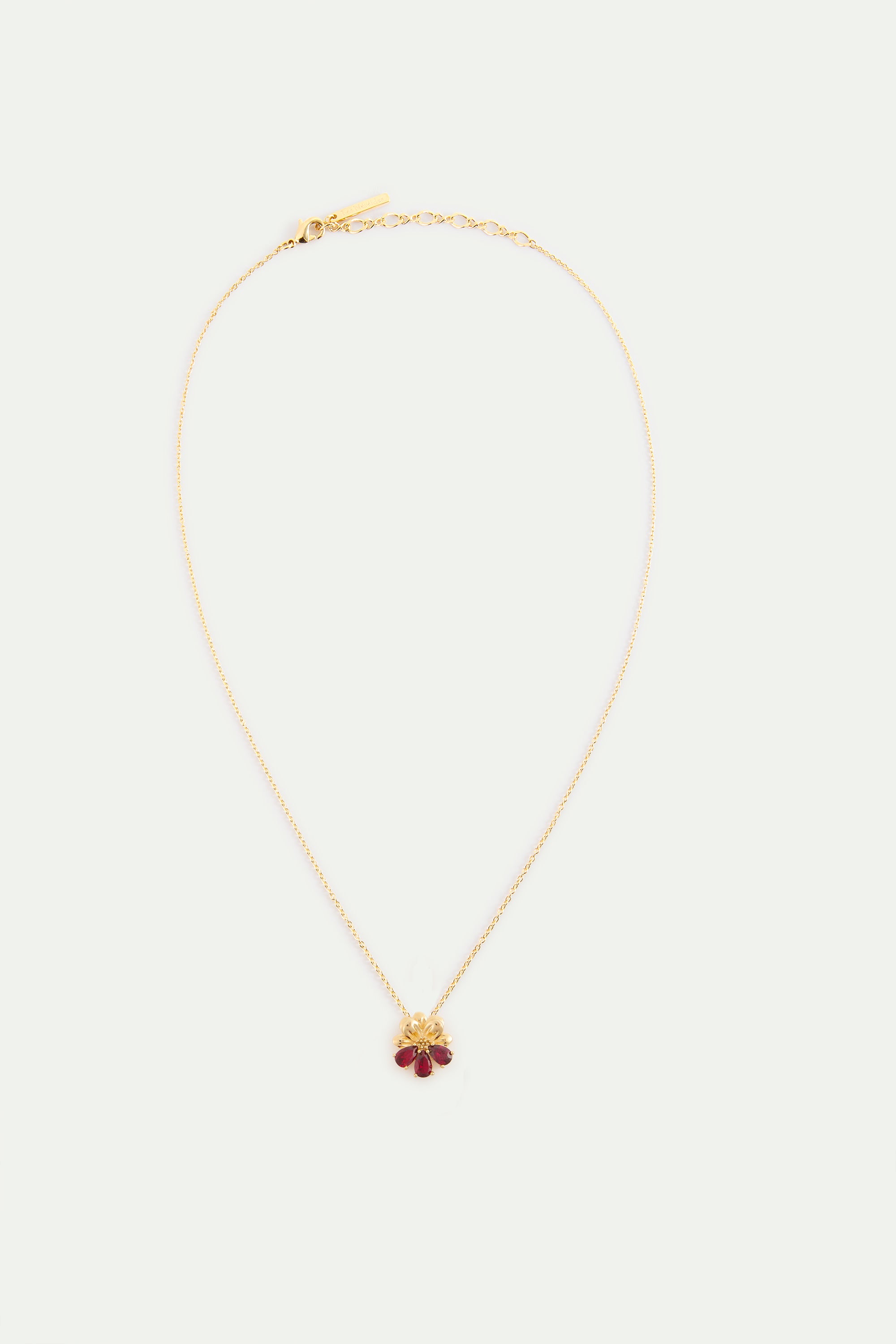 Collar con colgante cosmos y piedras rojas