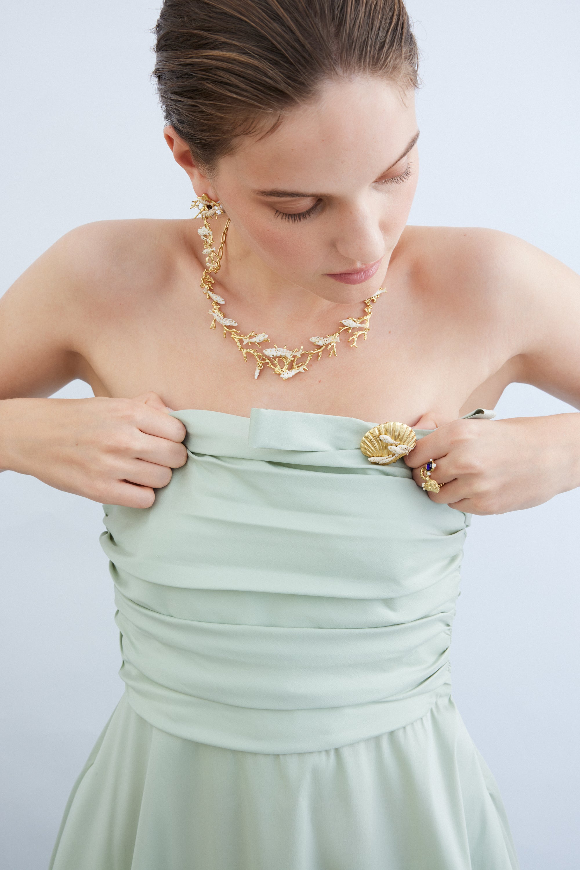 Golden coral and white fish statement necklace