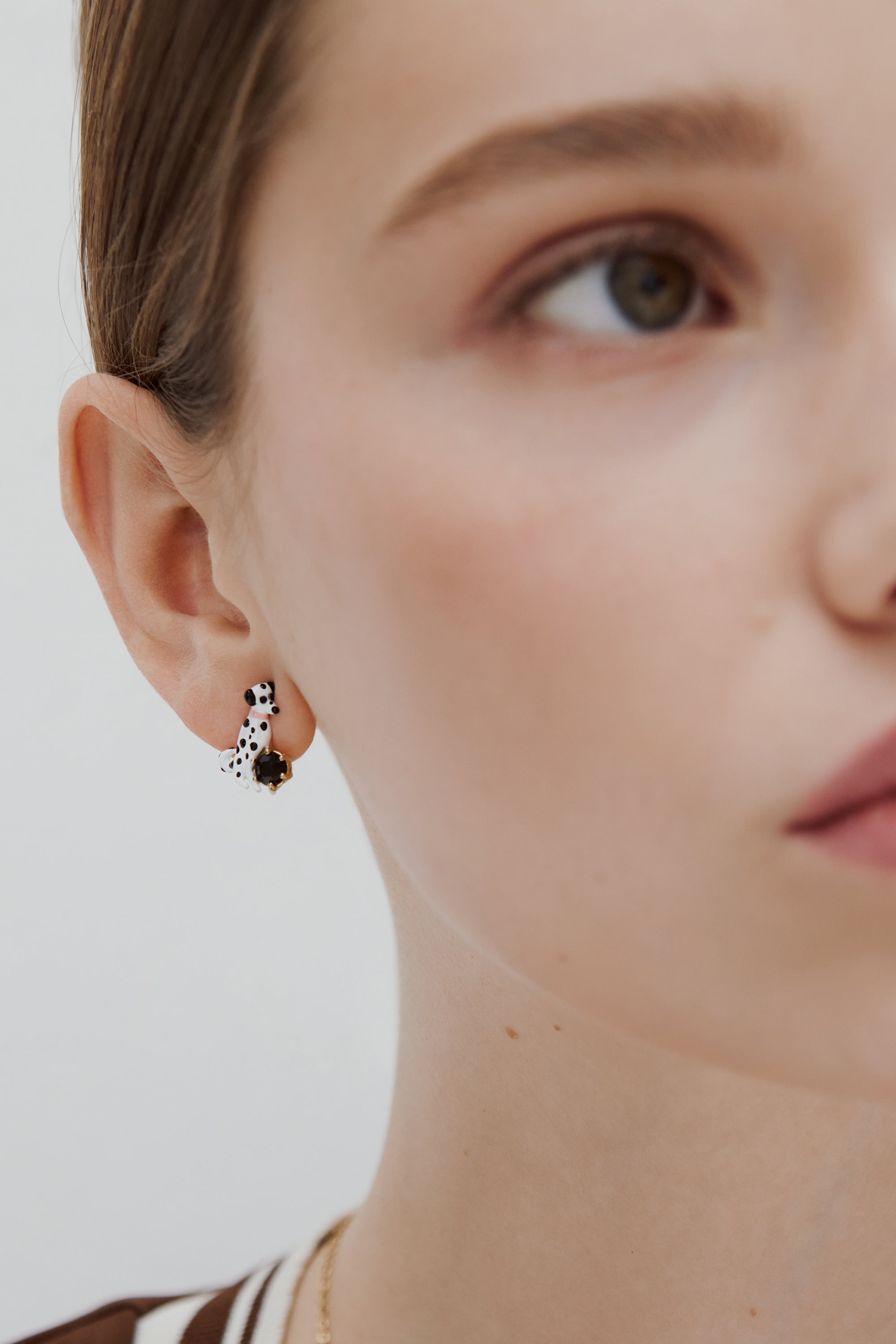 Asymmetrical post earrings with dalmatian and black round faceted stone