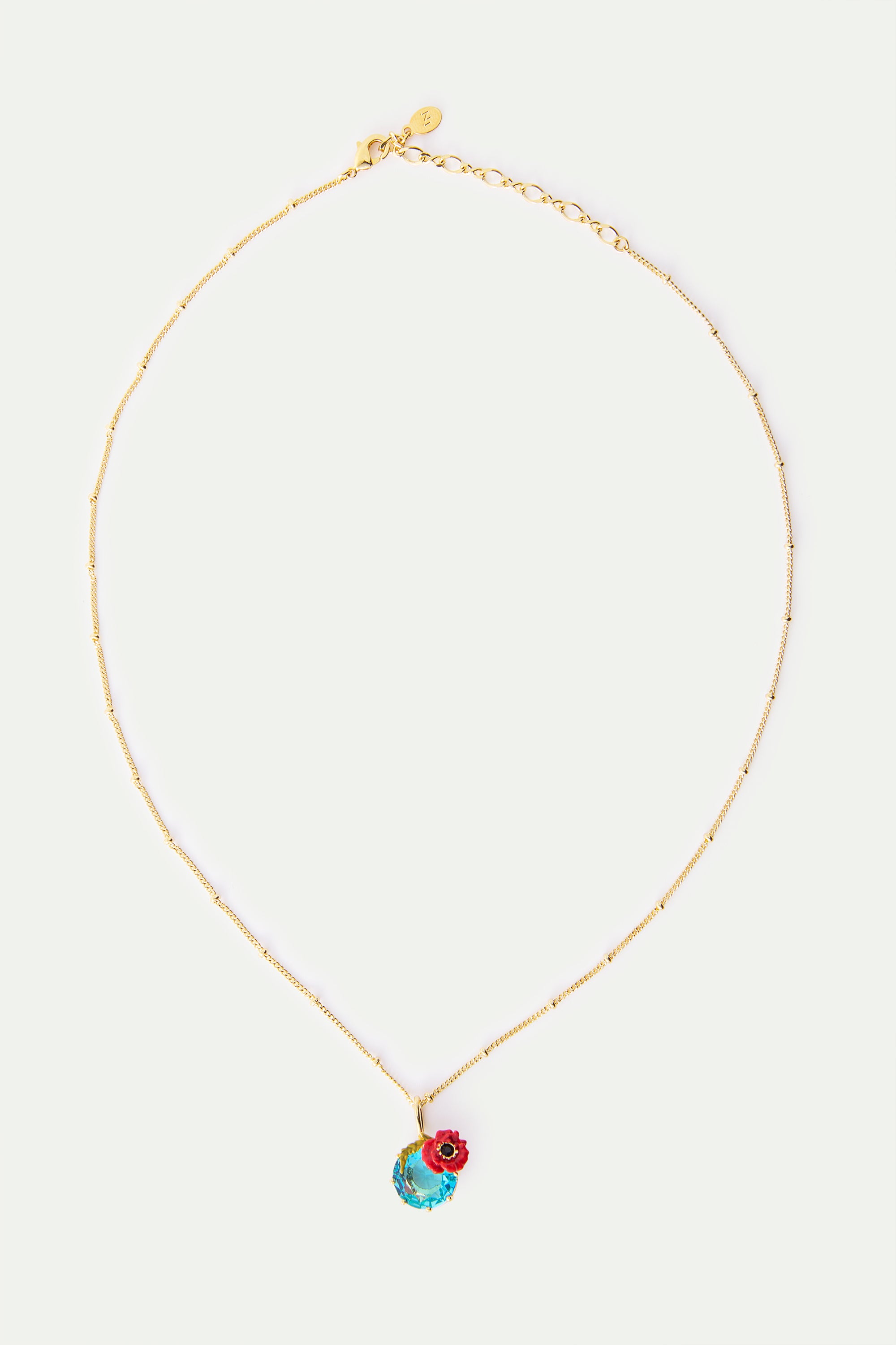 Collar con colgante de piedra redonda azul y amapola