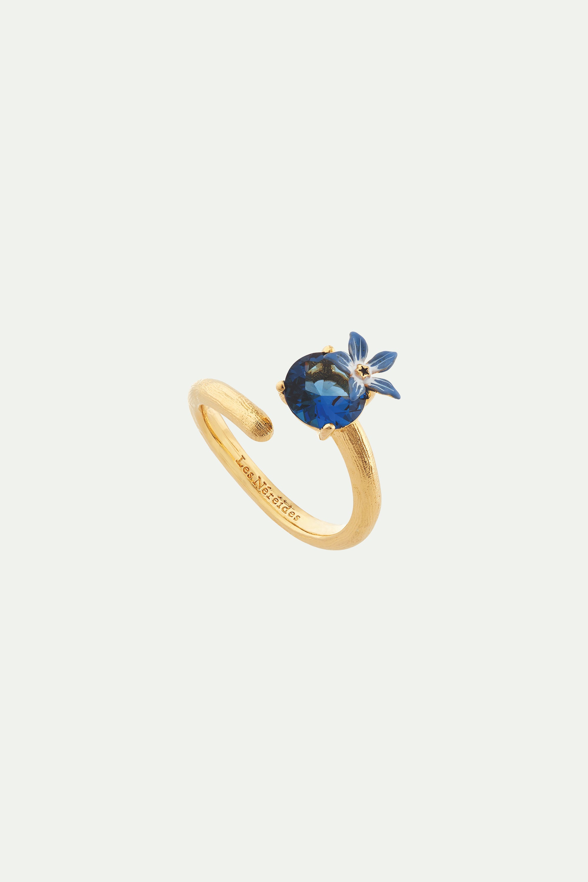 Anillo ajustable flor azul y cristal en facetas redondo