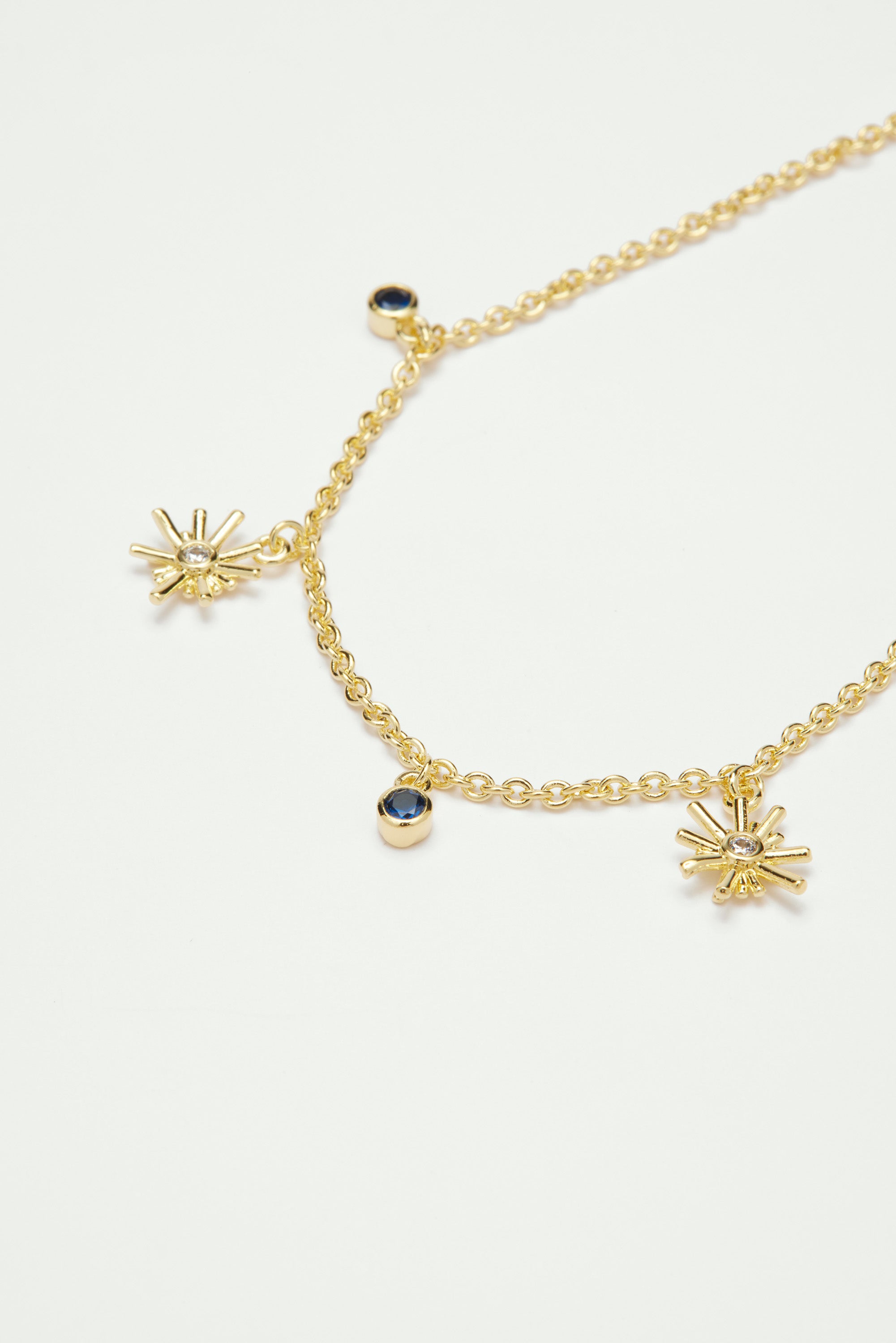 Gold stars and midnight blue stone charm bracelet