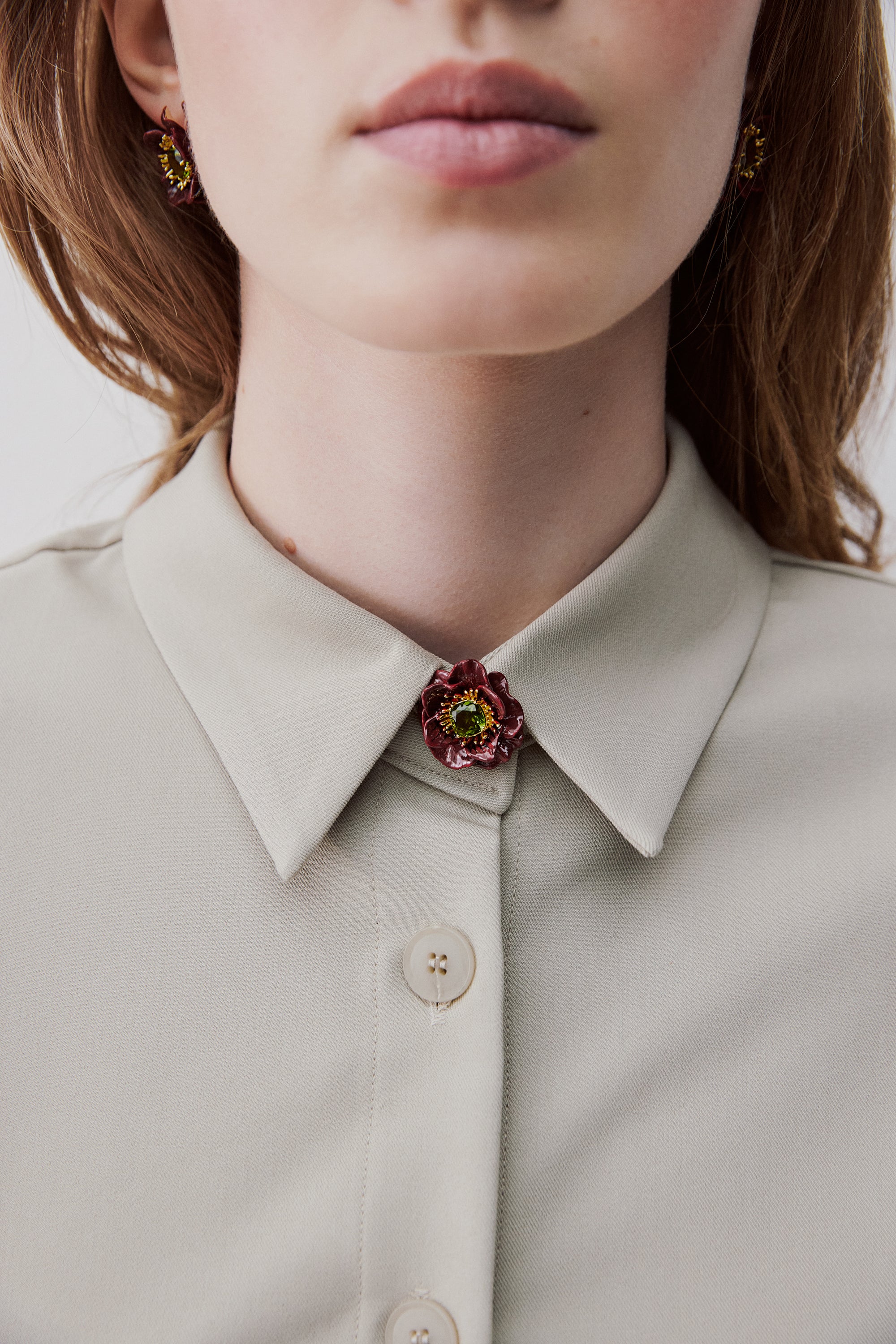 Burgundy anemone flower and green faceted stone brooch