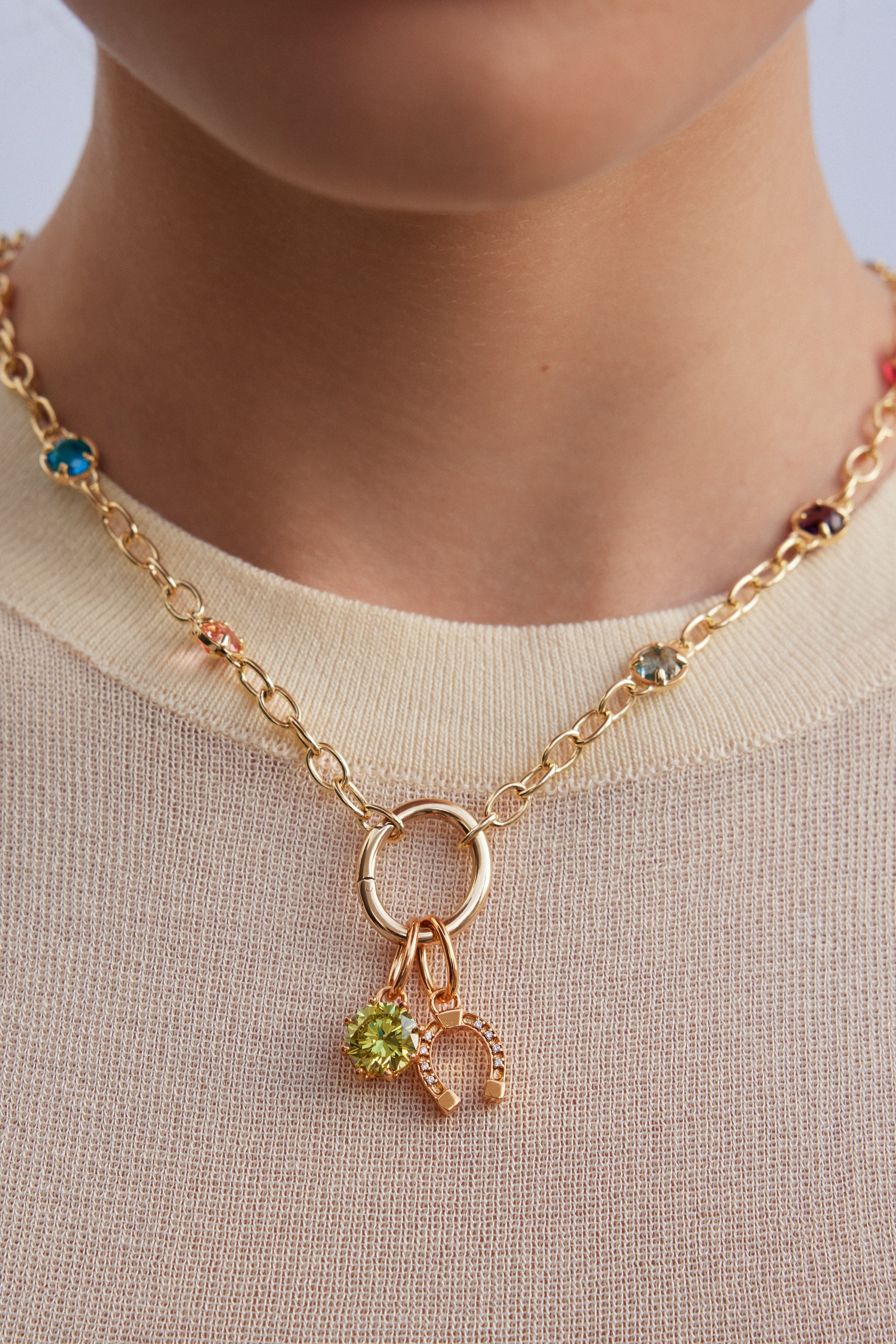 Gold-plated horseshoe pendant, Conjuring and Abnegation