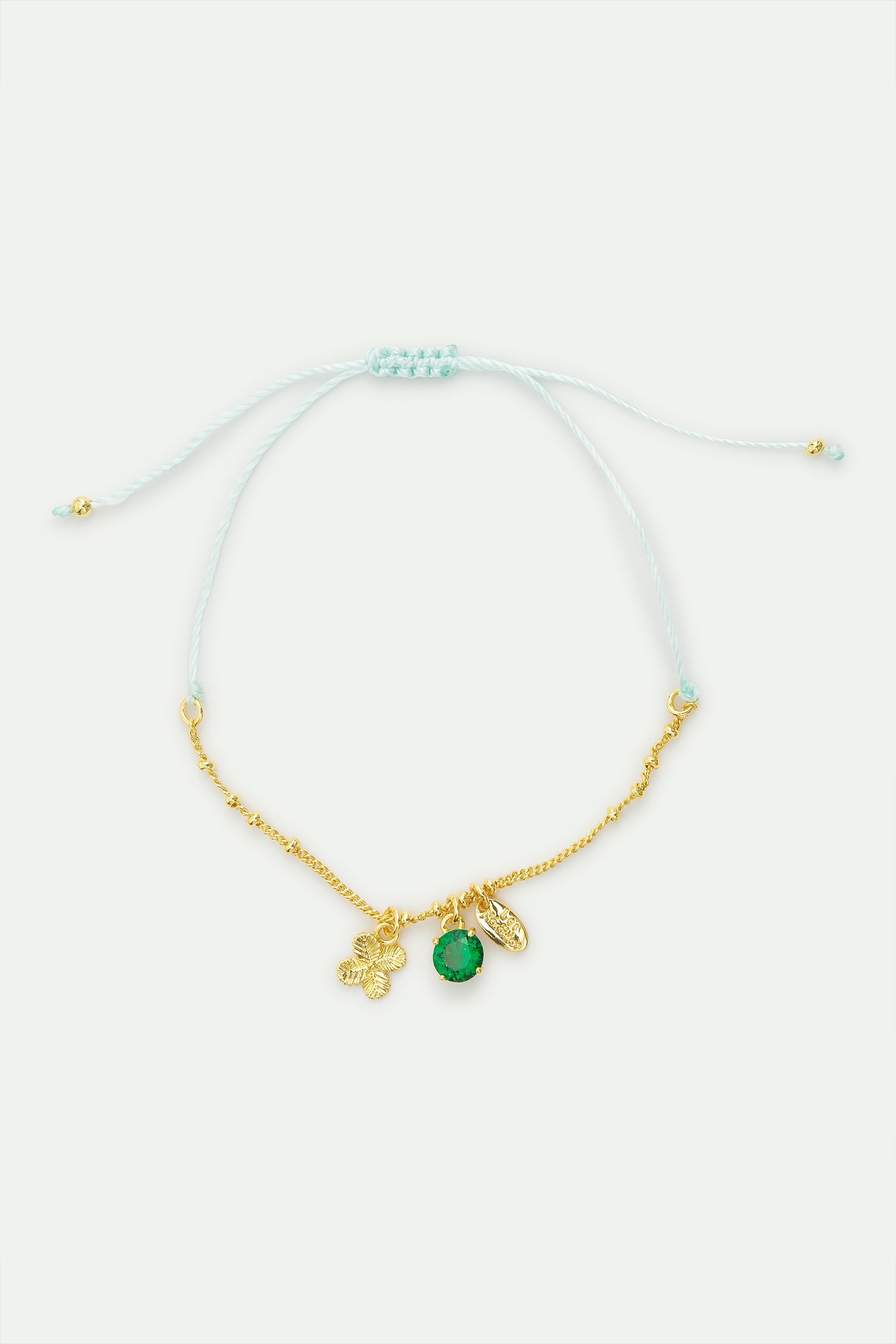 Pulsera fina colgante trébol dorado y cristal facetado verde