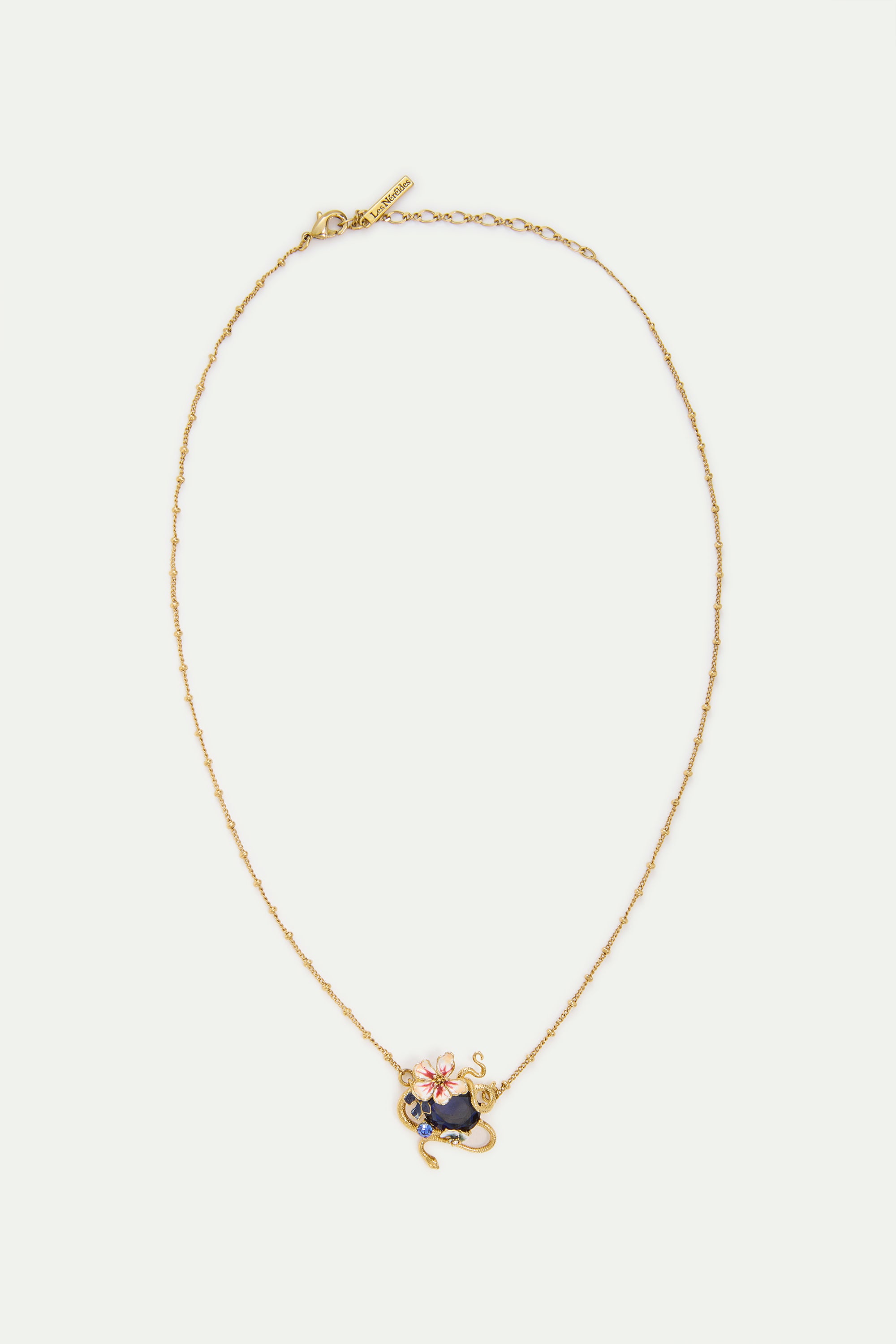 Necklace with blue faceted stone, gold snake and mallow flowers