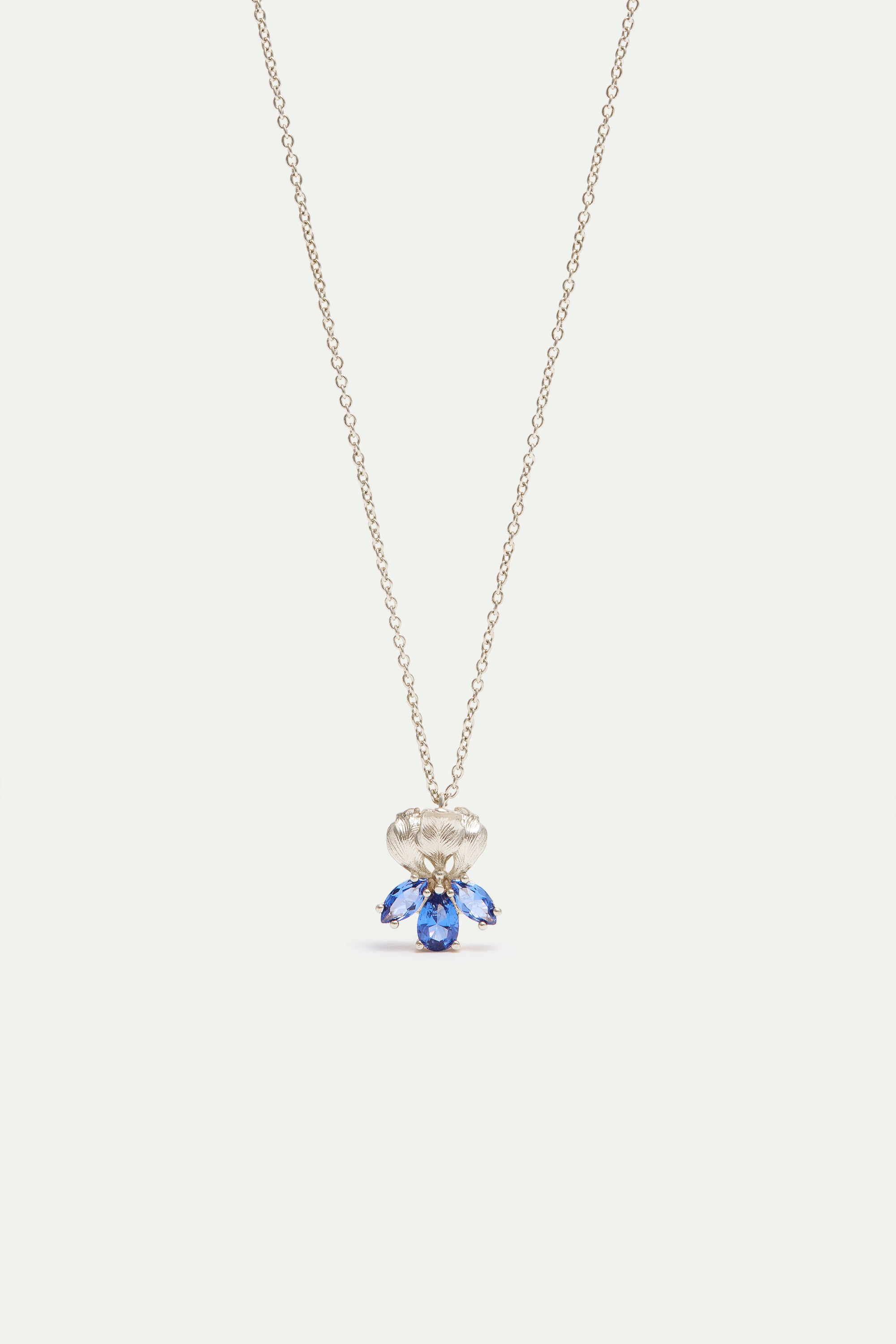 Silver iris and blue stone pendant necklace